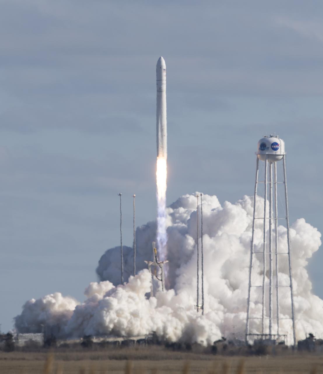The Northrop Grumman Antares rocket, with Cygnus resupply spacecraft onboard, launches from Pad-0A, Saturday, Feb. 15, 2020 at NASA's Wallops Flight Facility in Virginia. Northrop Grumman's 13th contracted cargo resupply mission for NASA to the International Space Station will deliver more than 7,500 pounds of science and research, crew supplies and vehicle hardware to the orbital laboratory and its crew. Photo Credit: (NASA/Aubrey Gemignani)