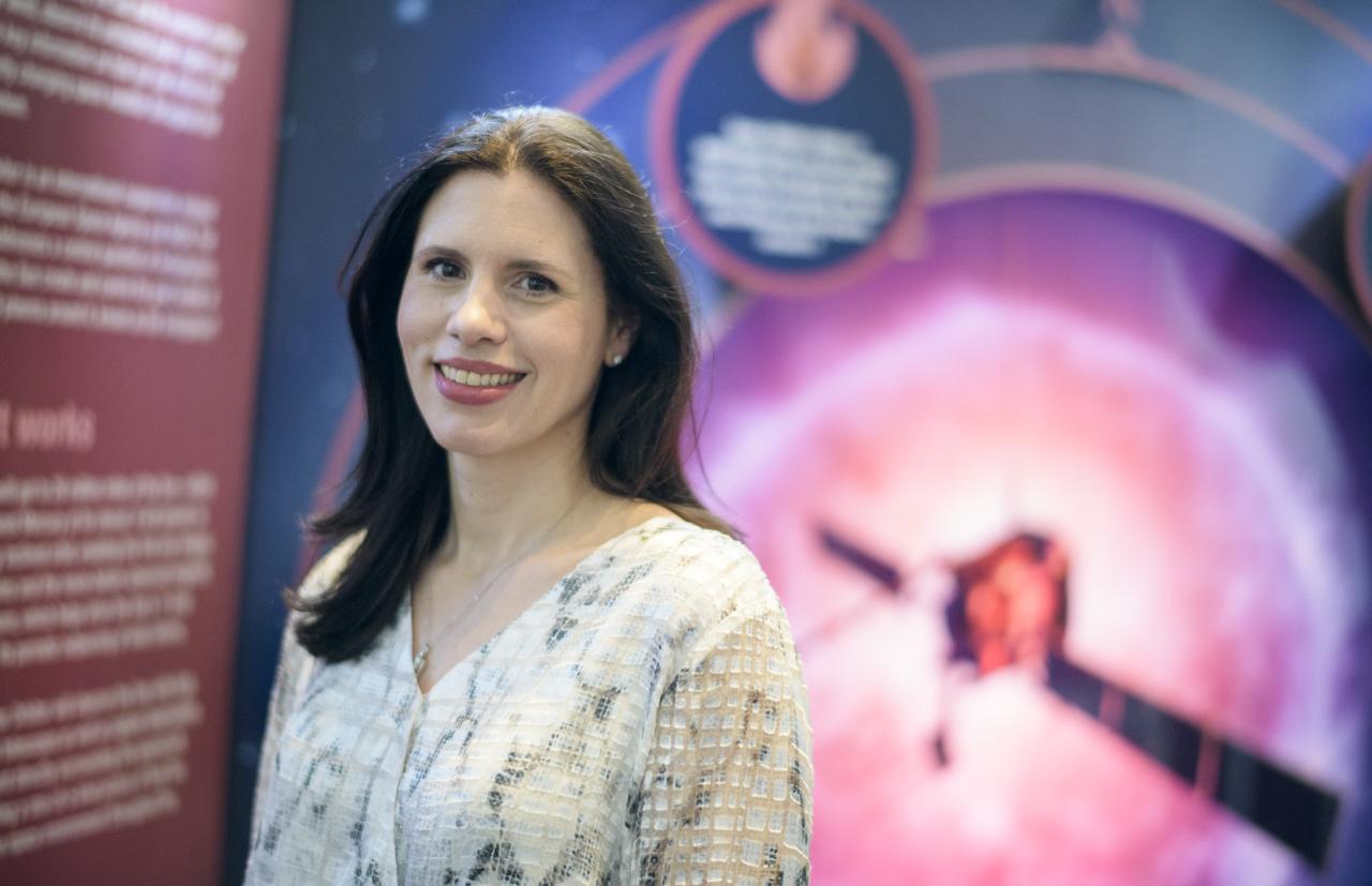 “When I started at Headquarters, I worked on slide design. Presentation work. All I was doing was formatting Powerpoint. That was it.   “But the lady I was grouped with — Mary Pat Hrybyk-Keith — she really coached me on what NASA is all about. She told me, ‘Put your foot in the door. Show them what you can do.’ And she was so right.   “I think that’s the mistake that a lot of younger people make. They want this perfect job right away. It’s definitely not that way. Most of the time, you get a job just to get a job. You have to get your foot in the door. So I did that here. I started showing them different things that I could do. They would ask me for something for a chart and I would give them an illustration in Photoshop. I wanted to show them that I could make photo-realistic, scientific illustrations. And slowly over time, I did that. I worked a lot of extra hours. And now, I’m not just formatting words and pictures on a slide anymore.   “The job just got better and better and better. I’ve just had door after door open up for me. I have a lot of clients who let me try exciting, new things. I constantly feel like I’m refreshed and invigorated and excited. I don’t know how many people can say, ‘I want to go home and keep working on this!’”  Jenny Mottar, Art Director for NASA Science, Wednesday, March 4, 2020, at NASA Headquarters in Washington, DC.  Photo Credit: (NASA/Joel Kowsky)