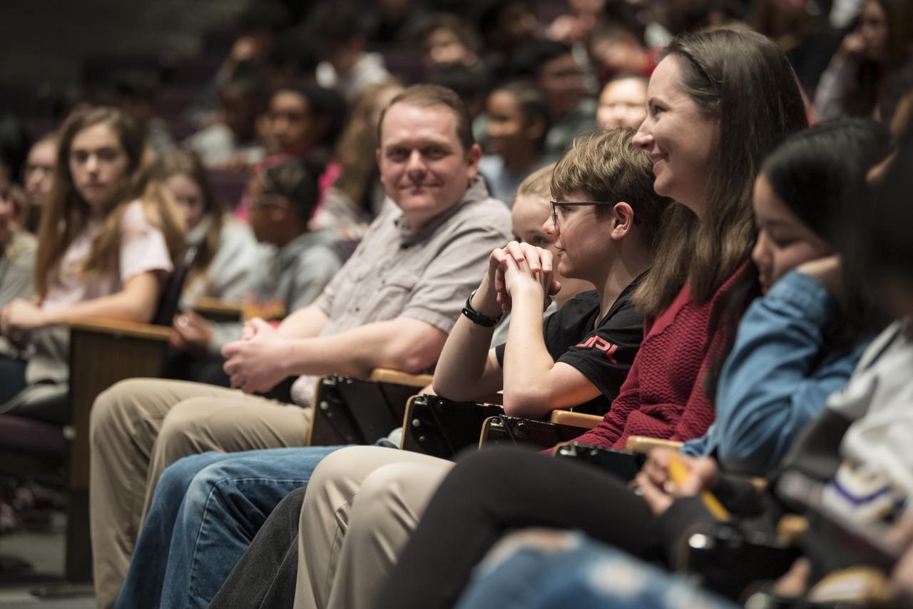 Alex Mather, the student whose submission, Perseverance, was chosen as the official name of the Mars 2020 rover, is seen in the audience seated with his family, Thursday, March 5, 2020, at Lake Braddock Secondary School in Burke, Va. The final selection of the new name was made by Associate Administrator of NASA's Science Mission Directorate, Thomas Zurbuchen, following a nationwide naming contest conducted in 2019 that drew more than 28,000 essays by K-12 students from every U.S. state and territory. Perseverance is currently at NASA's Kennedy Space Center in Florida being prepared for launch this summer. Photo Credit: (NASA/Aubrey Gemignani)