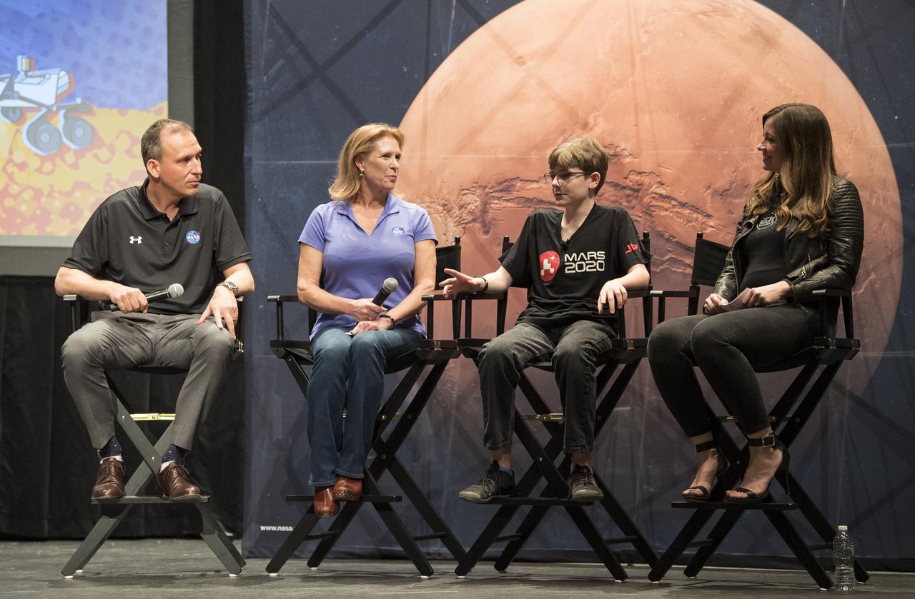 Alex Mather, the student whose submission, Perseverance, was chosen as the official name of the Mars 2020 rover, second from right, answers a question from Lori Glaze, Director of the Planetary Science Division of NASA's Science Mission Directorate, second from left, Thursday, March 5, 2020, at Lake Braddock Secondary School in Burke, Va. The final selection of the new name was made by Associate Administrator of NASA's Science Mission Directorate, Thomas Zurbuchen, left, following a nationwide naming contest conducted in 2019 that drew more than 28,000 essays by K-12 students from every U.S. state and territory. Perseverance is currently at NASA's Kennedy Space Center in Florida being prepared for launch this summer. Photo Credit: (NASA/Aubrey Gemignani)