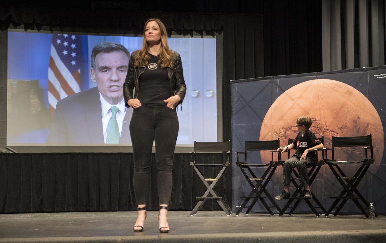 Alex Mather watches a congratulatory video from Sen. Mark Warner, D-Va, during an event to announce the official name of the Mars 2020 rover, Thursday, March 5, 2020, at Lake Braddock Secondary School in Burke, Va. The final selection of the new name, Perseverance, was made by Associate Administrator of NASA's Science Mission Directorate, Thomas Zurbuchen, following a nationwide naming contest conducted in 2019 that drew more than 28,000 essays by K-12 students from every U.S. state and territory. The rover is currently at NASA's Kennedy Space Center in Florida being prepared for launch this summer. Photo Credit: (NASA/Aubrey Gemignani)