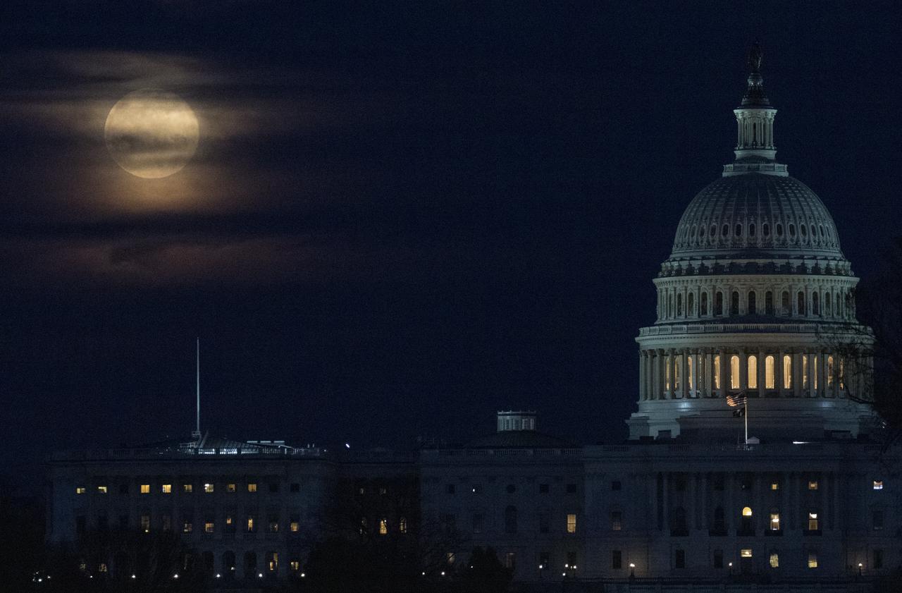 The Moon, or supermoon, is seen as it rises behind the U.S. Capitol, Monday, March 9, 2020, in Washington, DC. A supermoon occurs when the Moon’s orbit is closet (perigee) to Earth. Photo Credit: (NASA/Joel Kowsky)