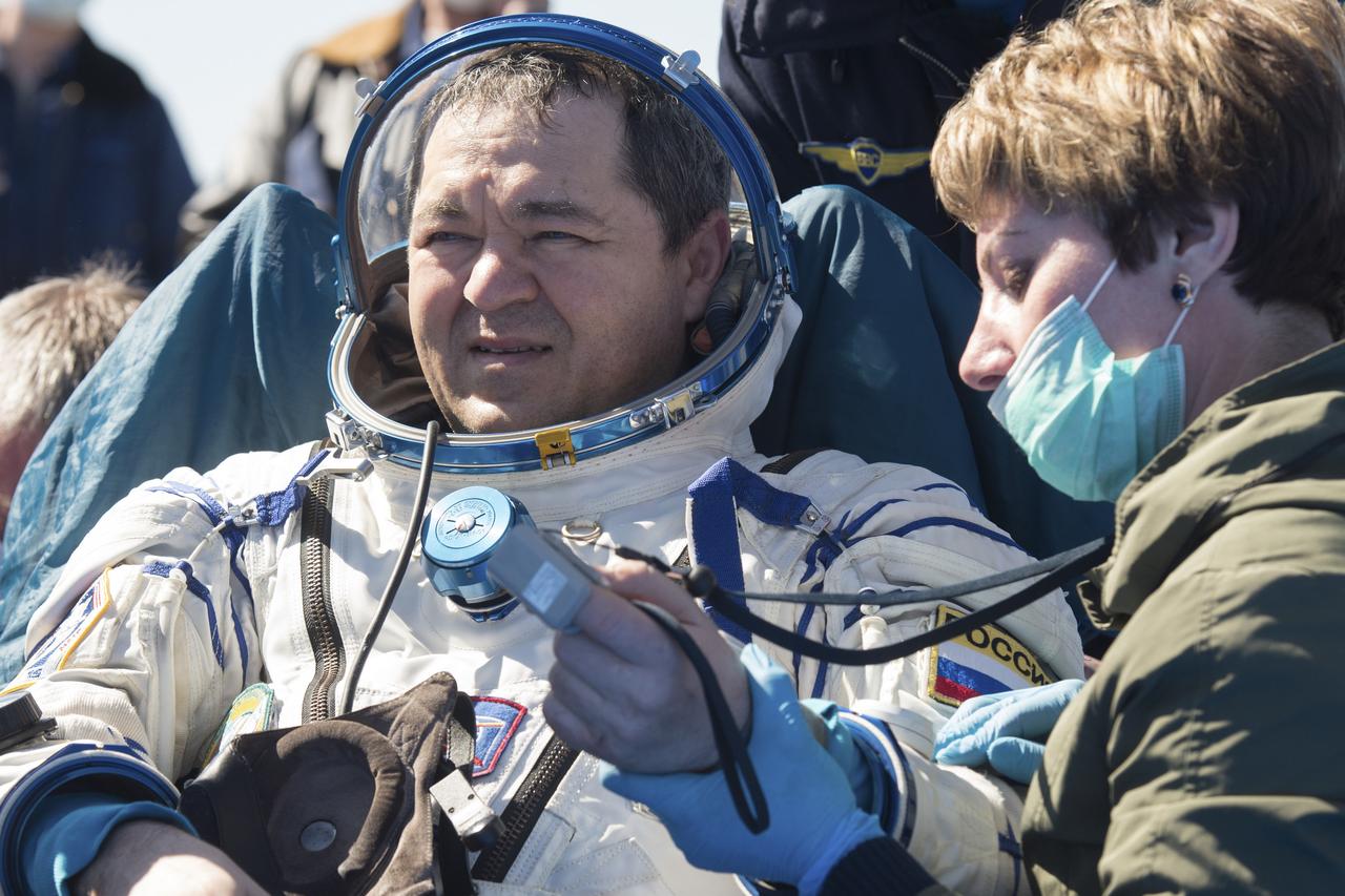 Expedition 62 cosmonaut Oleg Skripochka is seen outside the Soyuz MS-15 spacecraft after he landed with NASA astronauts Andrew Morgan and Jessica Meir in a remote area near the town of Zhezkazgan, Kazakhstan on Friday, April 17, 2020. Meir and Skripochka returned after 205 days in space, and Morgan after 272 days in space. All three served as Expedition 60-61-62 crew members onboard the International Space Station. Photo Credit: (NASA/GCTC/Andrey Shelepin)