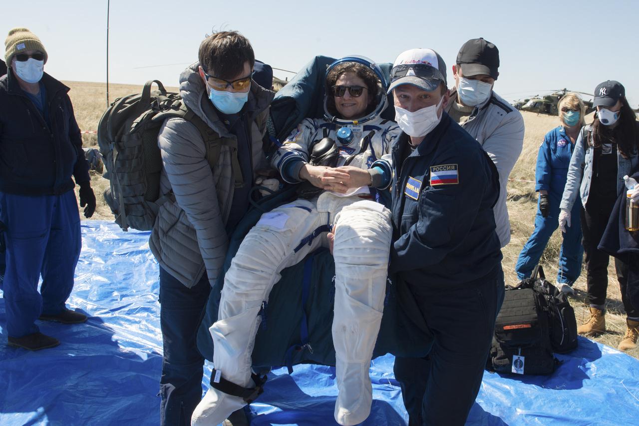 Expedition 62 crew member Jessica Meir of NASA is carried to an All Terrain Vehicle (ATV) shortly after she, NASA astronaut Andrew Morgan, and Roscosmos cosmonaut Oleg Skripochka landed in their Soyuz MS-15 spacecraft near the town of Zhezkazgan, Kazakhstan on Friday, April 17, 2020. Meir and Skripochka returned after 205 days in space, and Morgan after 272 days in space. All three served as Expedition 60-61-62 crew members onboard the International Space Station. Photo Credit: (NASA/GCTC/Andrey Shelepin)