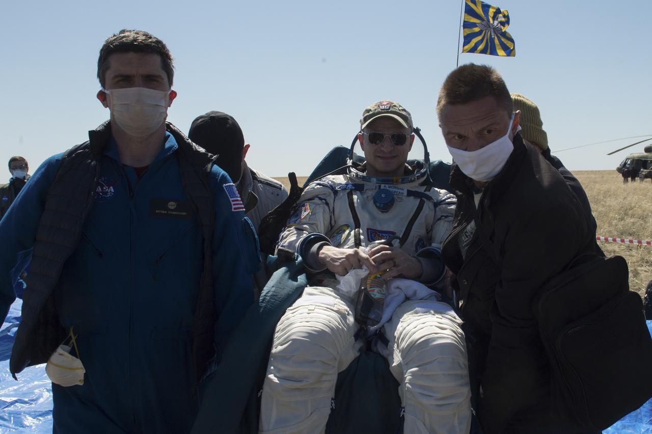 Expedition 62 crew member Andrew Morgan of NASA is carried to an All Terrain Vehicle (ATV) shortly after he, NASA astronaut Jessica Meir, and Roscosmos cosmonaut Oleg Skripochka landed in their Soyuz MS-15 spacecraft near the town of Zhezkazgan, Kazakhstan on Friday, April 17, 2020. Meir and Skripochka returned after 205 days in space, and Morgan after 272 days in space. All three served as Expedition 60-61-62 crew members onboard the International Space Station. Photo Credit: (NASA/GCTC/Andrey Shelepin)