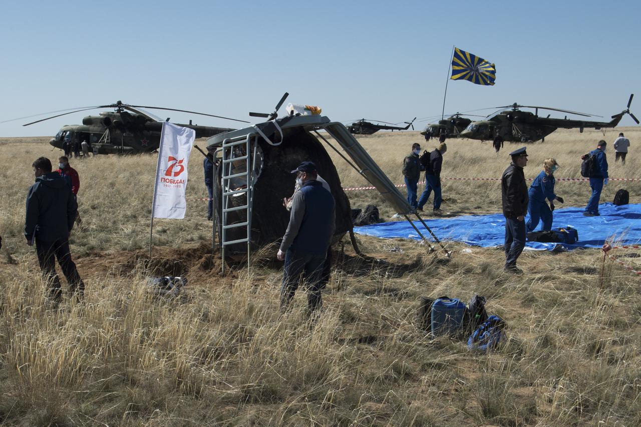 Russian support personnel work around the Soyuz MS-15 spacecraft shortly after it landed n a remote area near the town of Zhezkazgan, Kazakhstan with Expedition 62 crew members Jessica Meir and Drew Morgan of NASA, and Oleg Skripochka of Roscosmos, Friday, April 17, 2020. Meir and Skripochka returned after 205 days in space, and Morgan after 272 days in space. All three served as Expedition 60-61-62 crew members onboard the International Space Station. Photo Credit: (NASA/GCTC/Andrey Shelepin)