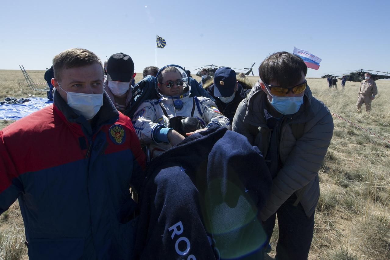 Expedition 62 crew member Oleg Skripochka of Roscosmos is carried to an All Terrain Vehicle (ATV) shortly after he and NASA astronauts Jessica Meir, and Andrew Morgan landed in their Soyuz MS-15 spacecraft near the town of Zhezkazgan, Kazakhstan on Friday, April 17, 2020. Meir and Skripochka returned after 205 days in space, and Morgan after 272 days in space. All three served as Expedition 60-61-62 crew members onboard the International Space Station. Photo Credit: (NASA/GCTC/Andrey Shelepin)