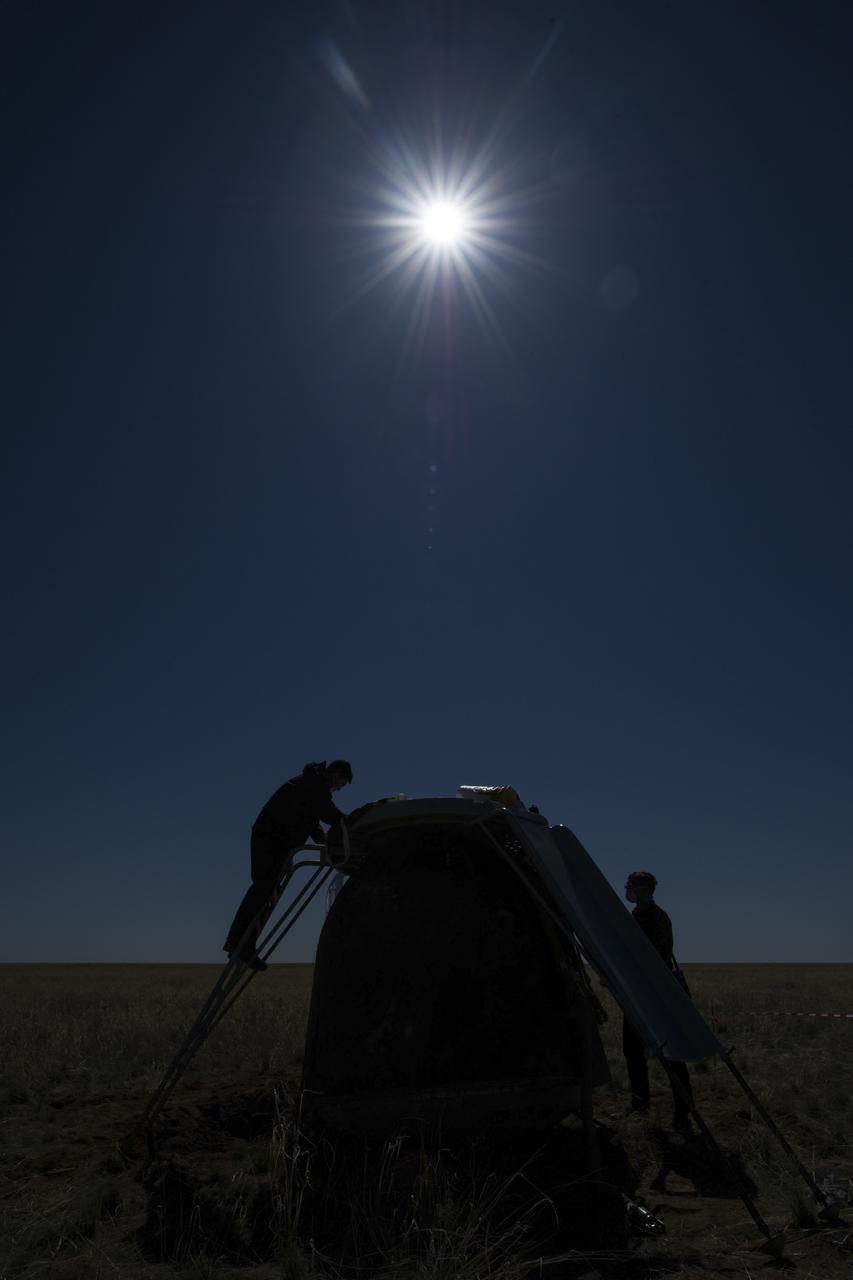 Russian support personnel work around the Soyuz MS-15 spacecraft shortly after it landed n a remote area near the town of Zhezkazgan, Kazakhstan with Expedition 62 crew members Jessica Meir and Drew Morgan of NASA, and Oleg Skripochka of Roscosmos, Friday, April 17, 2020. Meir and Skripochka returned after 205 days in space, and Morgan after 272 days in space. All three served as Expedition 60-61-62 crew members onboard the International Space Station. Photo Credit: (NASA/GCTC/Andrey Shelepin)