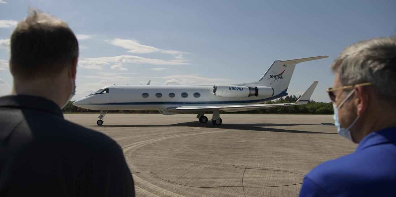 NASA Administrator Jim Bridenstine, left, and Kennedy Space Center Director Bob Cabana wait to greet NASA astronauts Douglas Hurley and Robert Behnken as they arrive at the Launch and Landing Facility at NASA’s Kennedy Space Center ahead of SpaceX’s Demo-2 mission, Wednesday, May 20, 2020, in Florida. NASA’s SpaceX Demo-2 mission is the first launch with astronauts of the SpaceX Crew Dragon spacecraft and Falcon 9 rocket to the International Space Station as part of the agency’s Commercial Crew Program. The flight test will serve as an end-to-end demonstration of SpaceX’s crew transportation system. Behnken and Hurley are scheduled to launch at 4:33 p.m. EDT on Wednesday, May 27, from Launch Complex 39A at the Kennedy Space Center. A new era of human spaceflight is set to begin as American astronauts once again launch on an American rocket from American soil to low-Earth orbit for the first time since the conclusion of the Space Shuttle Program in 2011.  Photo Credit: (NASA/Bill Ingalls)