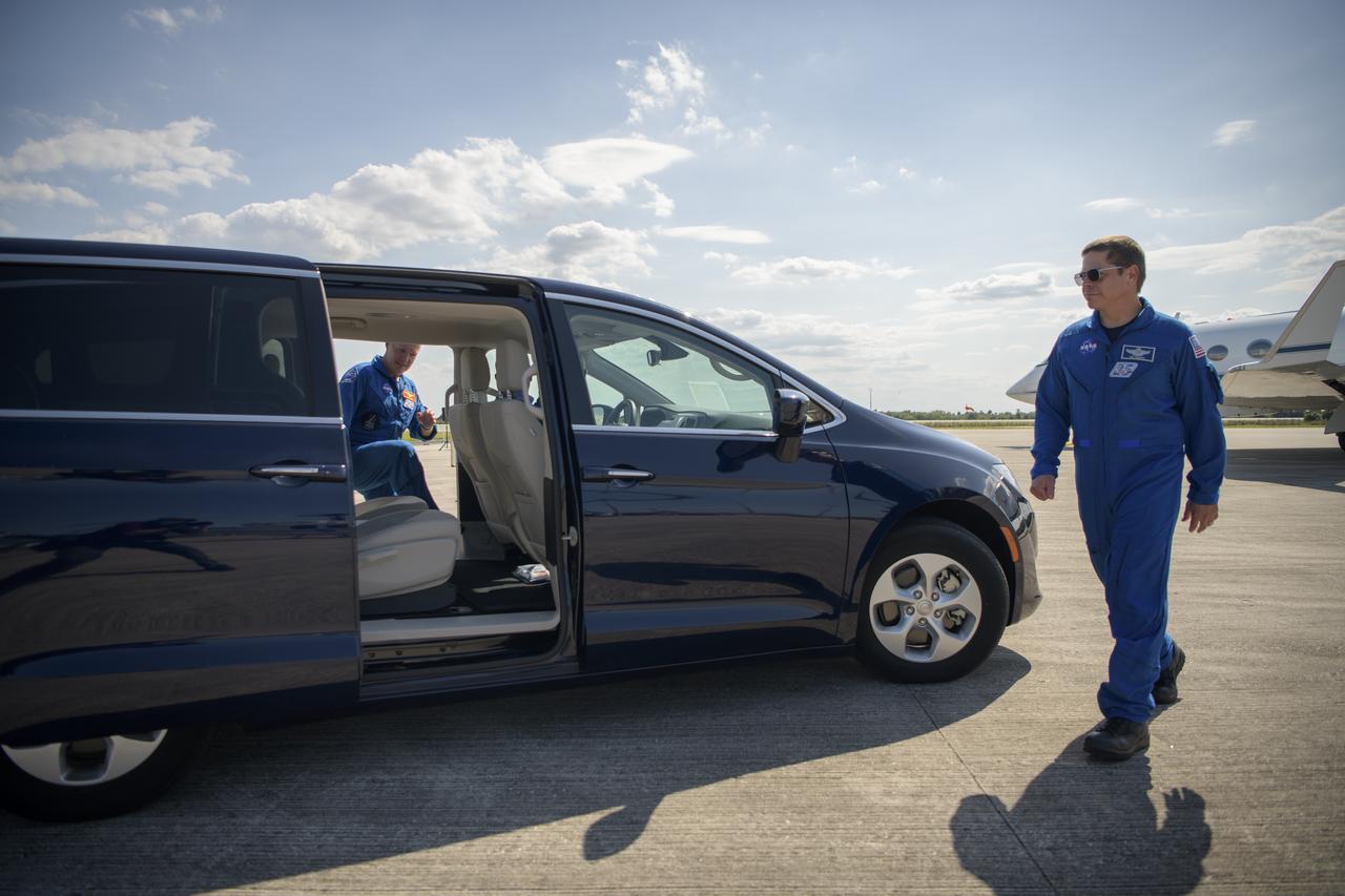 NASA astronauts Douglas Hurley, left, and Robert Behnken depart the Launch and Landing Facility and head to crew quarters at NASA’s Kennedy Space Center ahead of SpaceX’s Demo-2 mission, Wednesday, May 20, 2020, in Florida. NASA’s SpaceX Demo-2 mission is the first launch with astronauts of the SpaceX Crew Dragon spacecraft and Falcon 9 rocket to the International Space Station as part of the agency’s Commercial Crew Program. The flight test will serve as an end-to-end demonstration of SpaceX’s crew transportation system. Behnken and Hurley are scheduled to launch at 4:33 p.m. EDT on Wednesday, May 27, from Launch Complex 39A at the Kennedy Space Center. A new era of human spaceflight is set to begin as American astronauts once again launch on an American rocket from American soil to low-Earth orbit for the first time since the conclusion of the Space Shuttle Program in 2011.  Photo Credit: (NASA/Bill Ingalls)