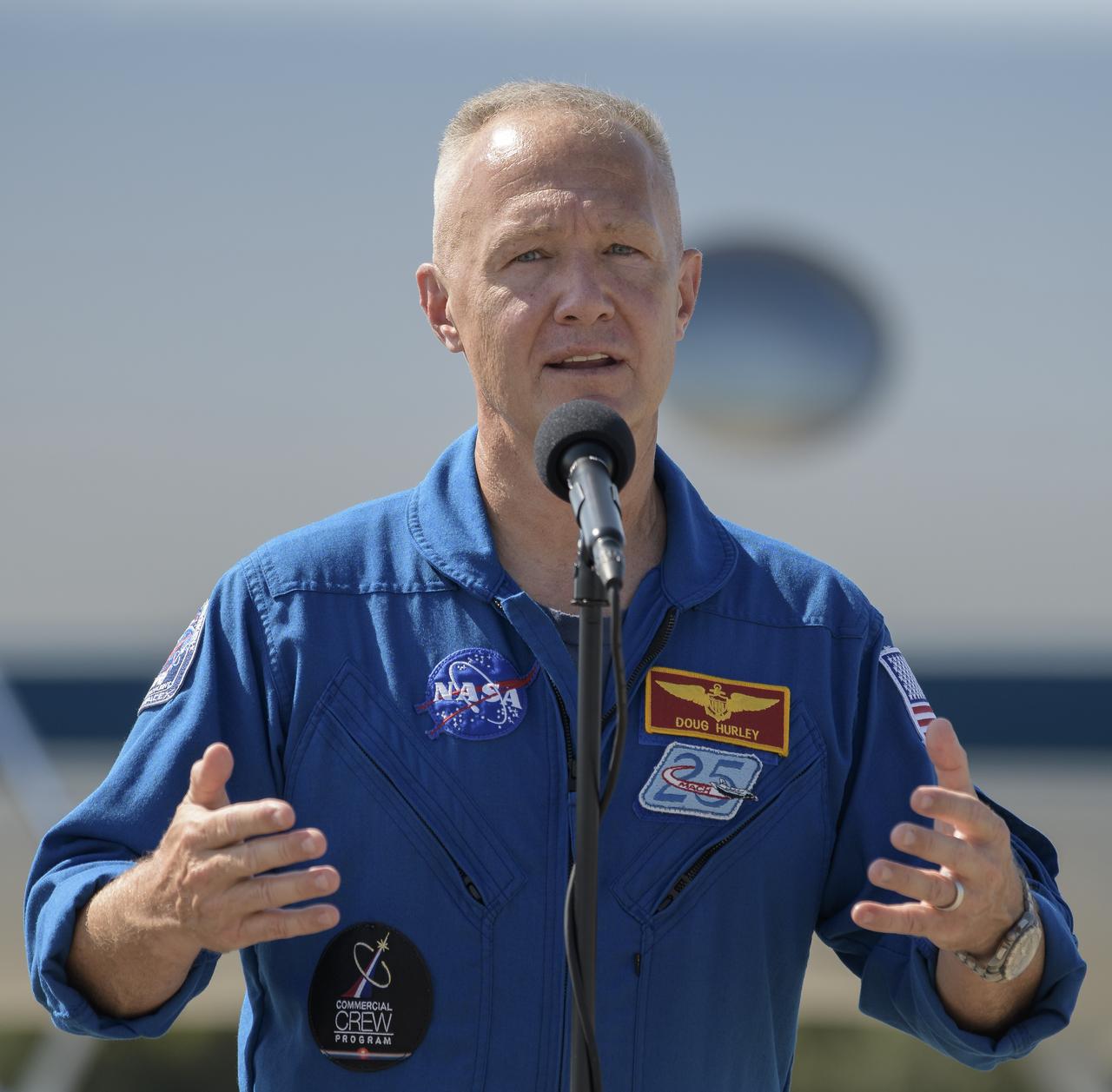 NASA astronaut Douglas Hurley speaks to members of the media after he and NASA astronaut Robert Behnken arrived at the Launch and Landing Facility at NASA’s Kennedy Space Center ahead of SpaceX’s Demo-2 mission, Wednesday, May 20, 2020, in Florida. NASA’s SpaceX Demo-2 mission is the first launch with astronauts of the SpaceX Crew Dragon spacecraft and Falcon 9 rocket to the International Space Station as part of the agency’s Commercial Crew Program. The flight test will serve as an end-to-end demonstration of SpaceX’s crew transportation system. Behnken and Hurley are scheduled to launch at 4:33 p.m. EDT on Wednesday, May 27, from Launch Complex 39A at the Kennedy Space Center. A new era of human spaceflight is set to begin as American astronauts once again launch on an American rocket from American soil to low-Earth orbit for the first time since the conclusion of the Space Shuttle Program in 2011.  Photo Credit: (NASA/Bill Ingalls)