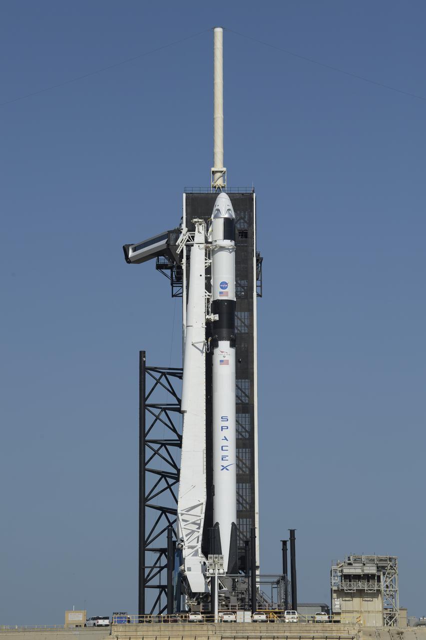 A SpaceX Falcon 9 rocket with the company's Crew Dragon spacecraft onboard is seen on the launch pad at Launch Complex 39A as preparations continue for the Demo-2 mission, Thursday, May 21, 2020, at NASA’s Kennedy Space Center in Florida. NASA’s SpaceX Demo-2 mission is the first launch with astronauts of the SpaceX Crew Dragon spacecraft and Falcon 9 rocket to the International Space Station as part of the agency’s Commercial Crew Program. The flight test will serve as an end-to-end demonstration of SpaceX’s crew transportation system. Behnken and Hurley are scheduled to launch at 4:33 p.m. EDT on Wednesday, May 27, from Launch Complex 39A at the Kennedy Space Center. A new era of human spaceflight is set to begin as American astronauts once again launch on an American rocket from American soil to low-Earth orbit for the first time since the conclusion of the Space Shuttle Program in 2011. Photo Credit: (NASA/Bill Ingalls)