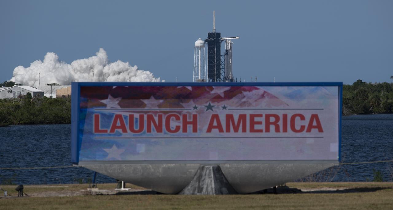 A SpaceX Falcon 9 rocket with the company's Crew Dragon spacecraft onboard is seen on the launch pad at Launch Complex 39A during a brief static fire test ahead of NASA’s SpaceX Demo-2 mission, Friday, May 22, 2020, at NASA’s Kennedy Space Center in Florida. NASA’s SpaceX Demo-2 mission is the first launch with astronauts of the SpaceX Crew Dragon spacecraft and Falcon 9 rocket to the International Space Station as part of the agency’s Commercial Crew Program. The test flight serves as an end-to-end demonstration of SpaceX’s crew transportation system. Robert Behnken and Douglas Hurley are scheduled to launch at 4:33 p.m. EDT on Wednesday, May 27, from Launch Complex 39A at the Kennedy Space Center. A new era of human spaceflight is set to begin as American astronauts once again launch on an American rocket from American soil to low-Earth orbit for the first time since the conclusion of the Space Shuttle Program in 2011. Photo Credit: (NASA/Joel Kowsky)
