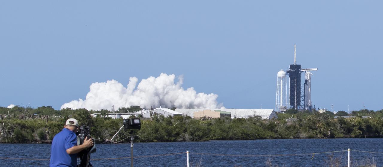 A SpaceX Falcon 9 rocket with the company's Crew Dragon spacecraft onboard is seen on the launch pad at Launch Complex 39A during a brief static fire test ahead of NASA’s SpaceX Demo-2 mission, Friday, May 22, 2020, at NASA’s Kennedy Space Center in Florida. NASA’s SpaceX Demo-2 mission is the first launch with astronauts of the SpaceX Crew Dragon spacecraft and Falcon 9 rocket to the International Space Station as part of the agency’s Commercial Crew Program. The test flight serves as an end-to-end demonstration of SpaceX’s crew transportation system. Robert Behnken and Douglas Hurley are scheduled to launch at 4:33 p.m. EDT on Wednesday, May 27, from Launch Complex 39A at the Kennedy Space Center. A new era of human spaceflight is set to begin as American astronauts once again launch on an American rocket from American soil to low-Earth orbit for the first time since the conclusion of the Space Shuttle Program in 2011. Photo Credit: (NASA/Joel Kowsky)
