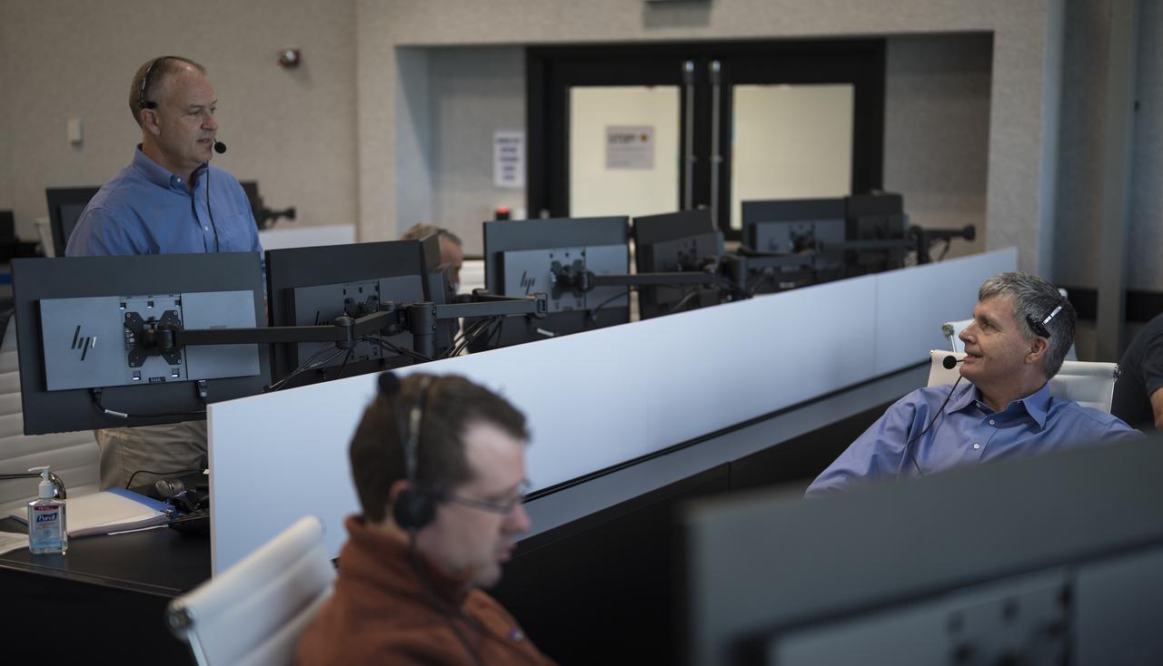 Norm Knight, deputy director of Flight Operations at NASA's Johnson Space Center, left, and Steve Stich, deputy manager of NASA’s Commercial Crew Program, right, monitor the countdown during a dress rehearsal in preparation for the launch of a SpaceX Falcon 9 rocket carrying the company's Crew Dragon spacecraft on NASA’s SpaceX Demo-2 mission with NASA astronauts Robert Behnken and Douglas Hurley onboard, Saturday, May 23, 2020, in firing room four of the Launch Control Center at NASA’s Kennedy Space Center in Florida. NASA’s SpaceX Demo-2 mission is the first launch with astronauts of the SpaceX Crew Dragon spacecraft and Falcon 9 rocket to the International Space Station as part of the agency’s Commercial Crew Program. The test flight serves as an end-to-end demonstration of SpaceX’s crew transportation system. Behnken and Hurley are scheduled to launch at 4:33 p.m. EDT on Wednesday, May 27, from Launch Complex 39A at the Kennedy Space Center. A new era of human spaceflight is set to begin as American astronauts once again launch on an American rocket from American soil to low-Earth orbit for the first time since the conclusion of the Space Shuttle Program in 2011. Photo Credit: (NASA/Joel Kowsky)