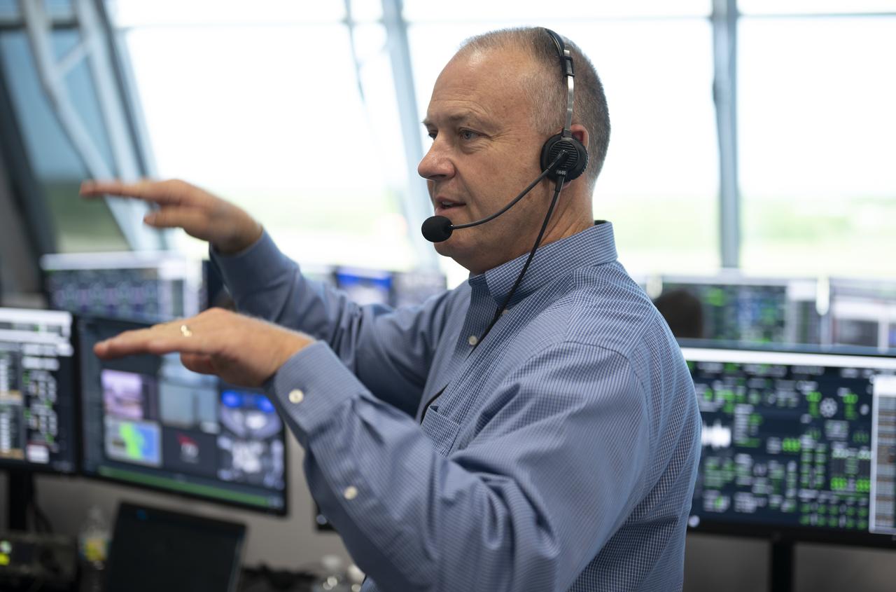 Norm Knight, deputy director of Flight Operations at NASA's Johnson Space Center, is seen as he monitors the countdown during a dress rehearsal in preparation for the launch of a SpaceX Falcon 9 rocket carrying the company's Crew Dragon spacecraft on NASA’s SpaceX Demo-2 mission with NASA astronauts Robert Behnken and Douglas Hurley onboard, Saturday, May 23, 2020, in firing room four of the Launch Control Center at NASA’s Kennedy Space Center in Florida. NASA’s SpaceX Demo-2 mission is the first launch with astronauts of the SpaceX Crew Dragon spacecraft and Falcon 9 rocket to the International Space Station as part of the agency’s Commercial Crew Program. The test flight serves as an end-to-end demonstration of SpaceX’s crew transportation system. Behnken and Hurley are scheduled to launch at 4:33 p.m. EDT on Wednesday, May 27, from Launch Complex 39A at the Kennedy Space Center. A new era of human spaceflight is set to begin as American astronauts once again launch on an American rocket from American soil to low-Earth orbit for the first time since the conclusion of the Space Shuttle Program in 2011. Photo Credit: (NASA/Bill Ingalls)