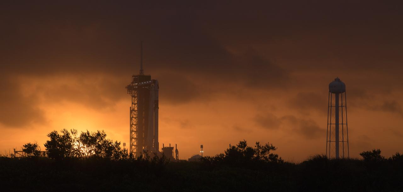 A SpaceX Falcon 9 rocket with the company's Crew Dragon spacecraft onboard is seen on the launch pad at Launch Complex 39A as preparations continue for the Demo-2 mission, Monday, May 25, 2020, at NASA’s Kennedy Space Center in Florida. NASA’s SpaceX Demo-2 mission is the first launch with astronauts of the SpaceX Crew Dragon spacecraft and Falcon 9 rocket to the International Space Station as part of the agency’s Commercial Crew Program. The test flight serves as an end-to-end demonstration of SpaceX’s crew transportation system. Robert Behnken and Douglas Hurley are scheduled to launch at 4:33 p.m. EDT on Wednesday, May 27, from Launch Complex 39A at the Kennedy Space Center. A new era of human spaceflight is set to begin as American astronauts once again launch on an American rocket from American soil to low-Earth orbit for the first time since the conclusion of the Space Shuttle Program in 2011. Photo Credit: (NASA/Bill Ingalls)