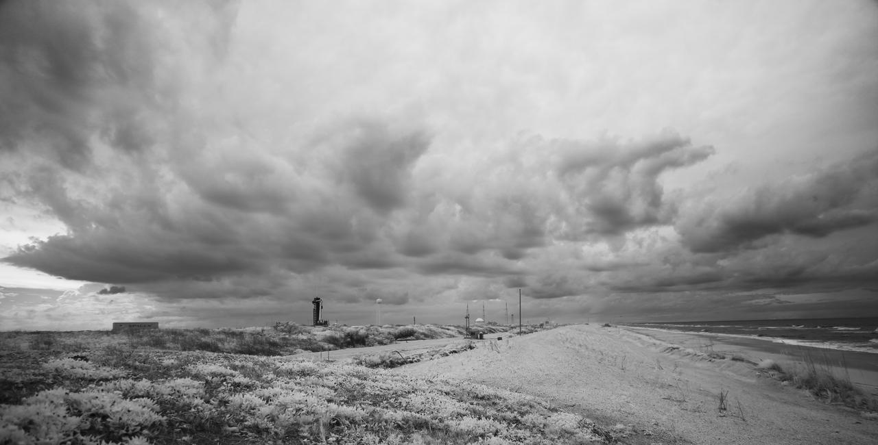 In this black and white infrared image, a SpaceX Falcon 9 rocket with the company's Crew Dragon spacecraft onboard is seen on the launch pad at Launch Complex 39A as preparations continue for the Demo-2 mission, Tuesday, May 26, 2020, at NASA’s Kennedy Space Center in Florida. NASA’s SpaceX Demo-2 mission is the first launch with astronauts of the SpaceX Crew Dragon spacecraft and Falcon 9 rocket to the International Space Station as part of the agency’s Commercial Crew Program. The test flight serves as an end-to-end demonstration of SpaceX’s crew transportation system. Robert Behnken and Douglas Hurley launched at 3:22 p.m. EDT on Saturday, May 30, from Launch Complex 39A at the Kennedy Space Center. A new era of human spaceflight is set to begin as American astronauts once again launch on an American rocket from American soil to low-Earth orbit for the first time since the conclusion of the Space Shuttle Program in 2011. Photo Credit: (NASA/Joel Kowsky)