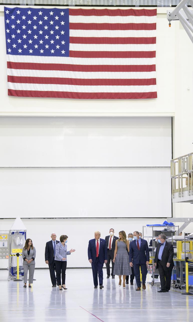 President Donald Trump, First Lady Melania Trump, Vice President Mike Pence, Second Lady Karen Pence, Marillyn Hewson, Chief Executive Officer, Lockheed Martin, NASA Administrator Jim Bridenstine, Kennedy Space Center Director Bob Cabana and Mike Hawes, VP and Orion Program Manager, Lockheed Martin, are seen during a tour of the Neil A. Armstrong Operations and Checkout Building following the departure of NASA astronauts Robert Behnken and Douglas Hurley for Launch Complex 39A to board a SpaceX Crew Dragon spacecraft for launch, Wednesday, May 27, 2020, at NASA’s Kennedy Space Center in Florida. NASA’s SpaceX Demo-2 mission is the first launch with astronauts of the SpaceX Crew Dragon spacecraft and Falcon 9 rocket to the International Space Station as part of the agency’s Commercial Crew Program. The flight test will serve as an end-to-end demonstration of SpaceX’s crew transportation system. Today’s launch of Behnken and Hurley was scrubbed due to weather and is now scheduled for 3:22 p.m. EDT on Saturday, May 30, from Launch Complex 39A at the Kennedy Space Center. A new era of human spaceflight is set to begin as American astronauts once again launch on an American rocket from American soil to low-Earth orbit for the first time since the conclusion of the Space Shuttle Program in 2011.  Photo Credit: (NASA/Bill Ingalls)