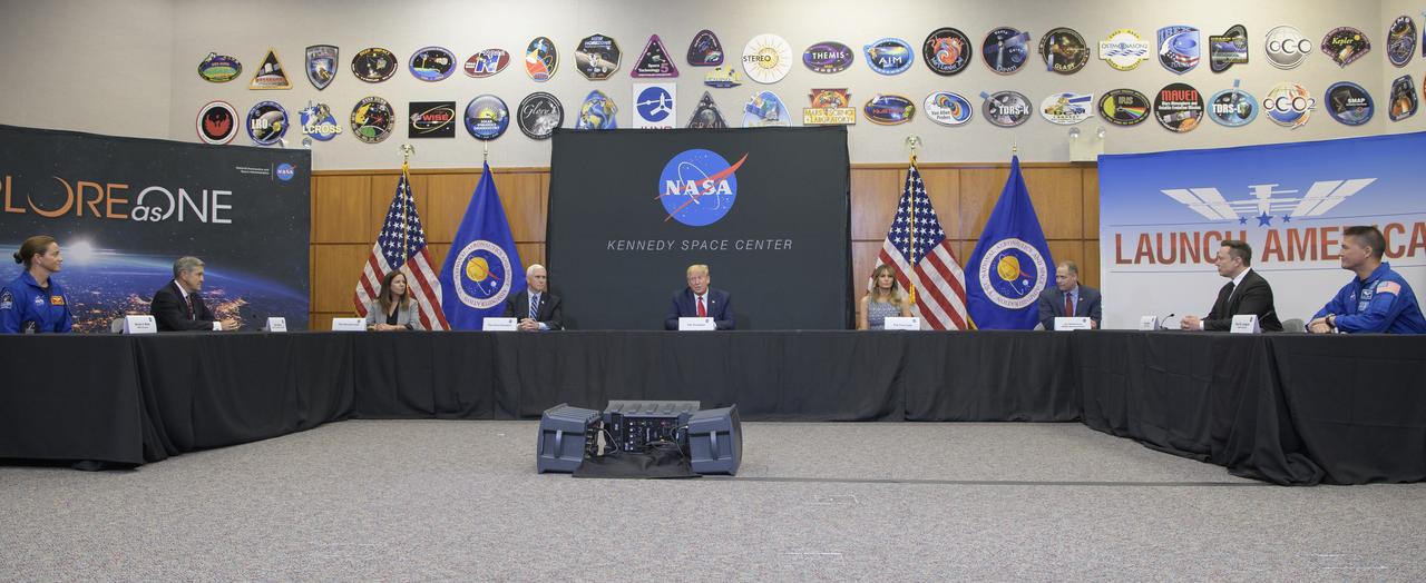 President Donald Trump participates in a SpaceX Demonstration Mission 2 Launch Briefing with NASA astronaut Nicole Mann, left, Kennedy Space Center Director Bob Cabana, Second Lady Karen Pence, Vice President Mike Pence, First Lady Melania Trump, NASA Administrator Jim Bridenstine, Elon Musk, SpaceX Chief Engineer, and NASA astronaut Kjell Lindgren, right at the Neil A. Armstrong Operations and Checkout Building following the departure of NASA astronauts Robert Behnken and Douglas Hurley for Launch Complex 39A to board a SpaceX Crew Dragon spacecraft for launch, Wednesday, May 27, 2020, at NASA’s Kennedy Space Center in Florida. NASA’s SpaceX Demo-2 mission is the first launch with astronauts of the SpaceX Crew Dragon spacecraft and Falcon 9 rocket to the International Space Station as part of the agency’s Commercial Crew Program. The test flight serves as an end-to-end demonstration of SpaceX’s crew transportation system. Today’s launch of Behnken and Hurley was scrubbed due to weather and is now scheduled for 3:22 p.m. EDT on Saturday, May 30, from Launch Complex 39A at the Kennedy Space Center. A new era of human spaceflight is set to begin as American astronauts once again launch on an American rocket from American soil to low-Earth orbit for the first time since the conclusion of the Space Shuttle Program in 2011.  Photo Credit: (NASA/Bill Ingalls)