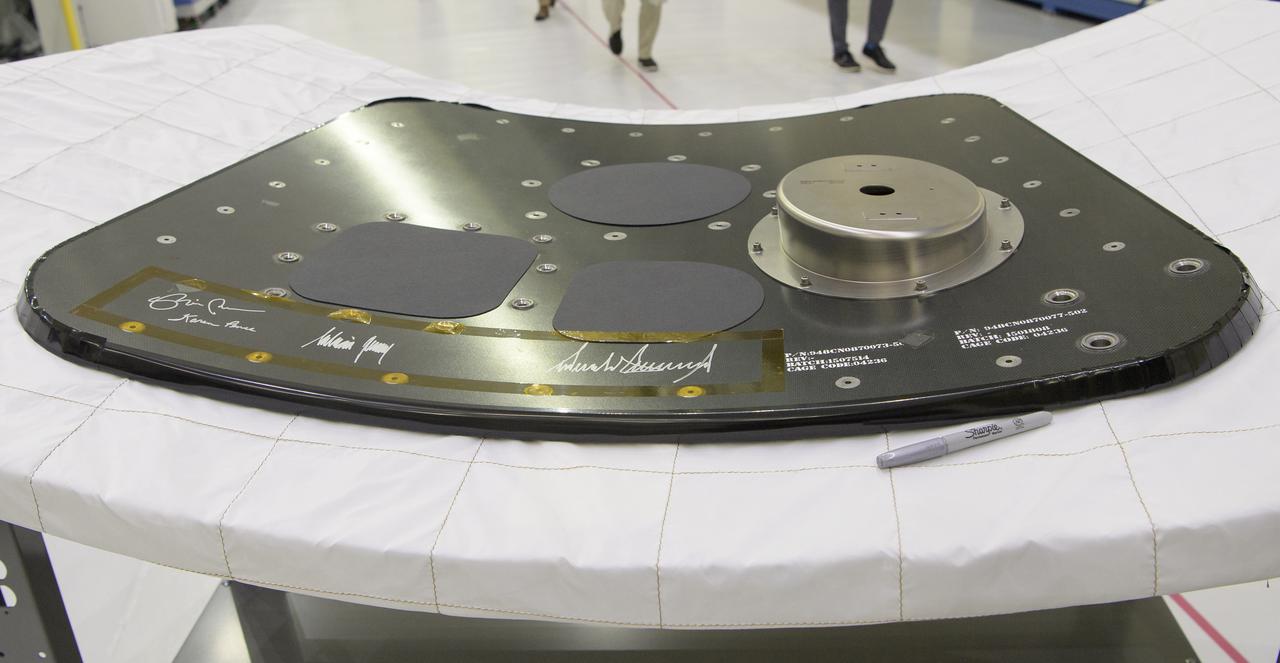An Orion capsule hatch that will be used for the Artemis II mission is seen after being signed by President Donald Trump and Vice President Mike Pence during a tour of the Neil A. Armstrong Operations and Checkout Building following the departure of NASA astronauts Robert Behnken and Douglas Hurley for Launch Complex 39A to board a SpaceX Crew Dragon spacecraft for launch, Wednesday, May 27, 2020, at NASA’s Kennedy Space Center in Florida. NASA’s SpaceX Demo-2 mission is the first launch with astronauts of the SpaceX Crew Dragon spacecraft and Falcon 9 rocket to the International Space Station as part of the agency’s Commercial Crew Program. The flight test will serve as an end-to-end demonstration of SpaceX’s crew transportation system. Today’s launch of Behnken and Hurley was scrubbed due to weather and is now scheduled for 3:22 p.m. EDT on Saturday, May 30, from Launch Complex 39A at the Kennedy Space Center. A new era of human spaceflight is set to begin as American astronauts once again launch on an American rocket from American soil to low-Earth orbit for the first time since the conclusion of the Space Shuttle Program in 2011. Photo Credit: (NASA/Bill Ingalls)
