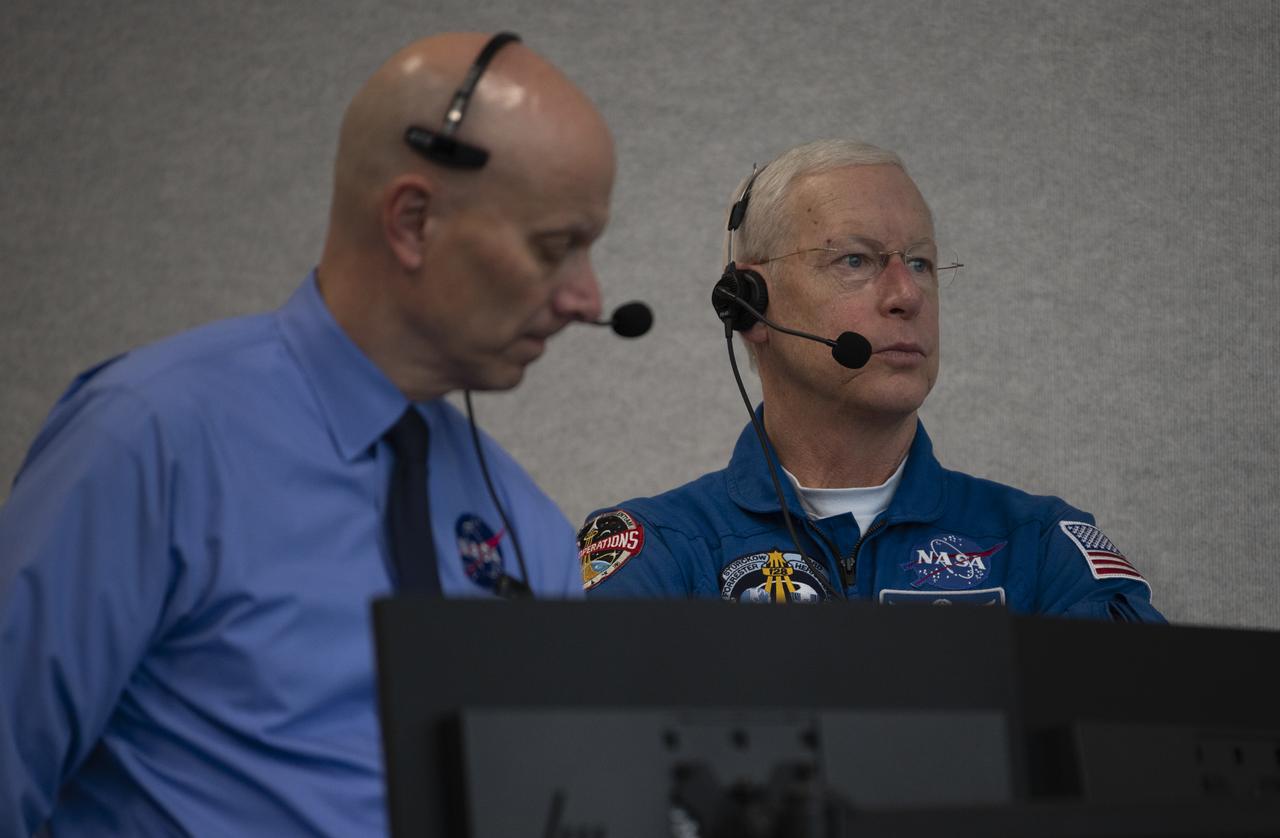 Stephen Koerner, Director of the Flight Operations Directorate at NASA’s Johnson Space Center, left, and Pat Forrester, NASA’s chief of the astronaut office, right, monitor the countdown of the launch attempt of a SpaceX Falcon 9 rocket carrying the company's Crew Dragon spacecraft on NASA’s SpaceX Demo-2 mission with NASA astronauts Robert Behnken and Douglas Hurley onboard, Wednesday, May 27, 2020, in firing room four of the Launch Control Center at NASA’s Kennedy Space Center in Florida. NASA’s SpaceX Demo-2 mission is the first launch with astronauts of the SpaceX Crew Dragon spacecraft and Falcon 9 rocket to the International Space Station as part of the agency’s Commercial Crew Program. The test flight serves as an end-to-end demonstration of SpaceX’s crew transportation system. Today’s launch of Behnken and Hurley was scrubbed due to weather and is now scheduled for 3:22 p.m. EDT on Saturday, May 30, from Launch Complex 39A at the Kennedy Space Center. A new era of human spaceflight is set to begin as American astronauts once again launch on an American rocket from American soil to low-Earth orbit for the first time since the conclusion of the Space Shuttle Program in 2011. Photo Credit: (NASA/Joel Kowsky)