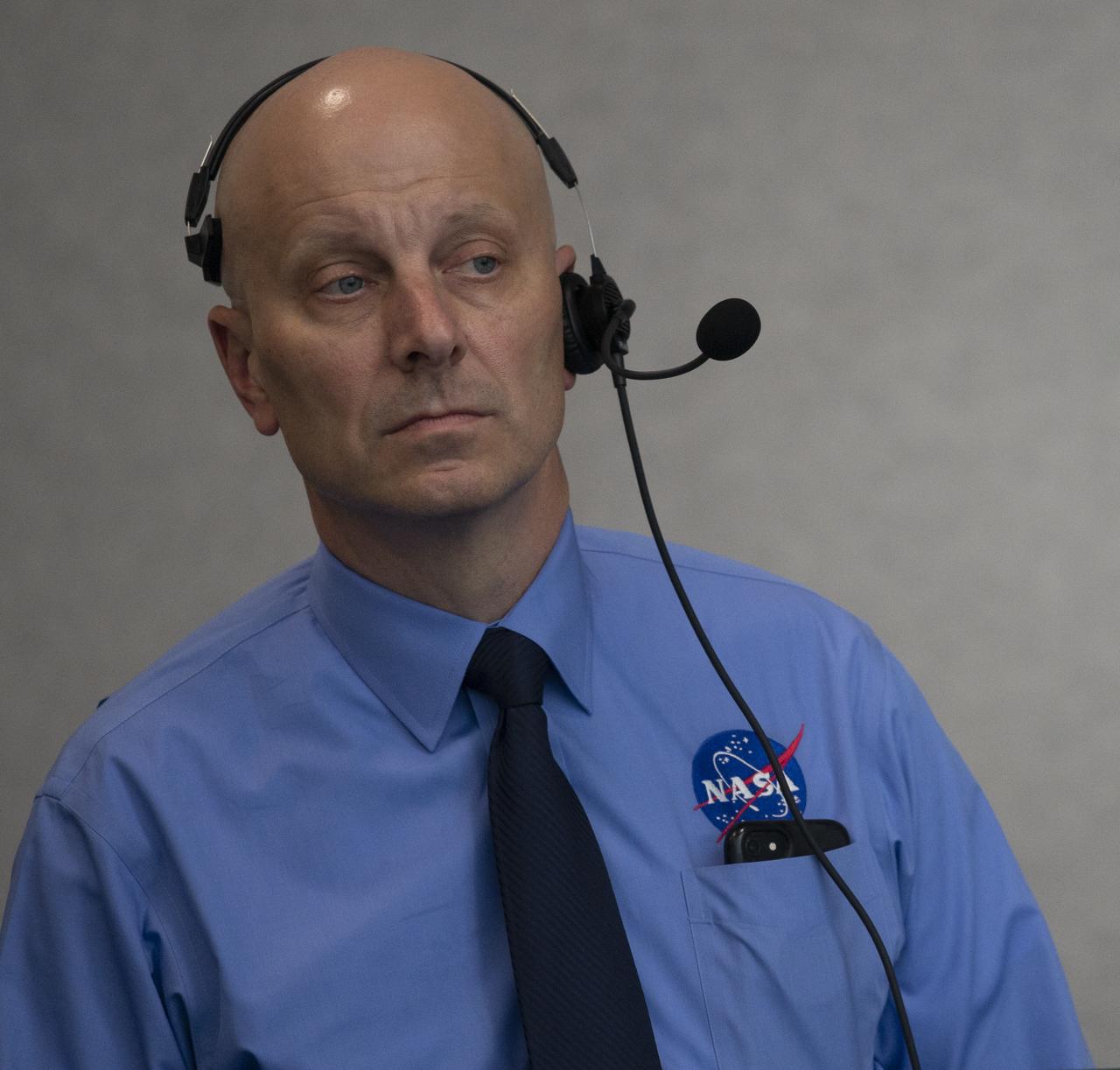 Stephen Koerner, Director of the Flight Operations Directorate at NASA’s Johnson Space Center, monitors the countdown of the launch attempt of a SpaceX Falcon 9 rocket carrying the company's Crew Dragon spacecraft on NASA’s SpaceX Demo-2 mission with NASA astronauts Robert Behnken and Douglas Hurley onboard, Wednesday, May 27, 2020, in firing room four of the Launch Control Center at NASA’s Kennedy Space Center in Florida. NASA’s SpaceX Demo-2 mission is the first launch with astronauts of the SpaceX Crew Dragon spacecraft and Falcon 9 rocket to the International Space Station as part of the agency’s Commercial Crew Program. The test flight serves as an end-to-end demonstration of SpaceX’s crew transportation system. Today’s launch of Behnken and Hurley was scrubbed due to weather and is now scheduled for 3:22 p.m. EDT on Saturday, May 30, from Launch Complex 39A at the Kennedy Space Center. A new era of human spaceflight is set to begin as American astronauts once again launch on an American rocket from American soil to low-Earth orbit for the first time since the conclusion of the Space Shuttle Program in 2011. Photo Credit: (NASA/Joel Kowsky)