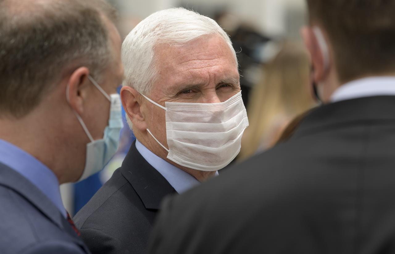 Vice President Mike Pence talks with NASA Administrator Jim Bridenstine, left, and Elon Musk, SpaceX Chief Engineer as they wait to see NASA astronauts Douglas Hurley and Robert Behnken depart the Neil A. Armstrong Operations and Checkout Building for Launch Complex 39A to board the SpaceX Crew Dragon spacecraft for the Demo-2 mission launch, Wednesday, May 27, 2020, at NASA’s Kennedy Space Center in Florida. NASA’s SpaceX Demo-2 mission is the first launch with astronauts of the SpaceX Crew Dragon spacecraft and Falcon 9 rocket to the International Space Station as part of the agency’s Commercial Crew Program. The test flight serves as an end-to-end demonstration of SpaceX’s crew transportation system. Today’s launch of Behnken and Hurley was scrubbed due to weather and is now scheduled for 3:22 p.m. EDT on Saturday, May 30, from Launch Complex 39A at the Kennedy Space Center. A new era of human spaceflight is set to begin as American astronauts once again launch on an American rocket from American soil to low-Earth orbit for the first time since the conclusion of the Space Shuttle Program in 2011. Photo Credit: (NASA/Bill Ingalls)