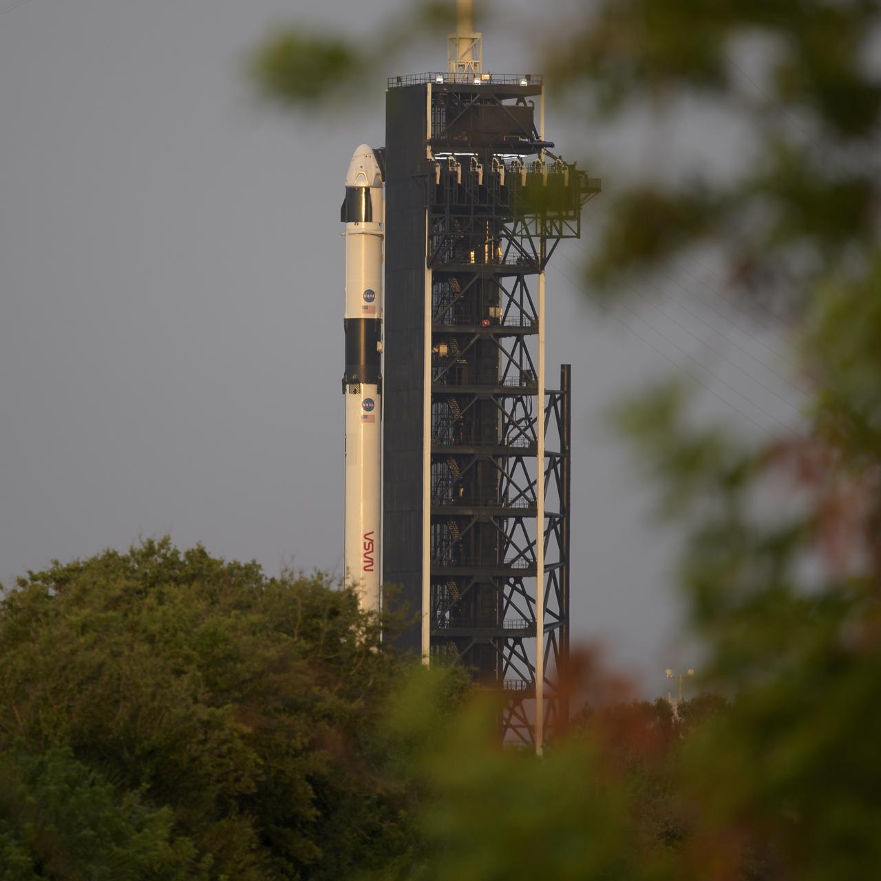 A SpaceX Falcon 9 rocket with the company's Crew Dragon spacecraft onboard is seen on the launch pad at Launch Complex 39A as preparations continue for the Demo-2 mission, Wednesday, May 27, 2020, at NASA’s Kennedy Space Center in Florida. NASA’s SpaceX Demo-2 mission is the first launch with astronauts of the SpaceX Crew Dragon spacecraft and Falcon 9 rocket to the International Space Station as part of the agency’s Commercial Crew Program. The test flight serves as an end-to-end demonstration of SpaceX’s crew transportation system. Today’s launch of Behnken and Hurley was scrubbed due to weather and is now scheduled for 3:22 p.m. EDT on Saturday, May 30, from Launch Complex 39A at the Kennedy Space Center. A new era of human spaceflight is set to begin as American astronauts once again launch on an American rocket from American soil to low-Earth orbit for the first time since the conclusion of the Space Shuttle Program in 2011. Photo Credit: (NASA/Bill Ingalls)