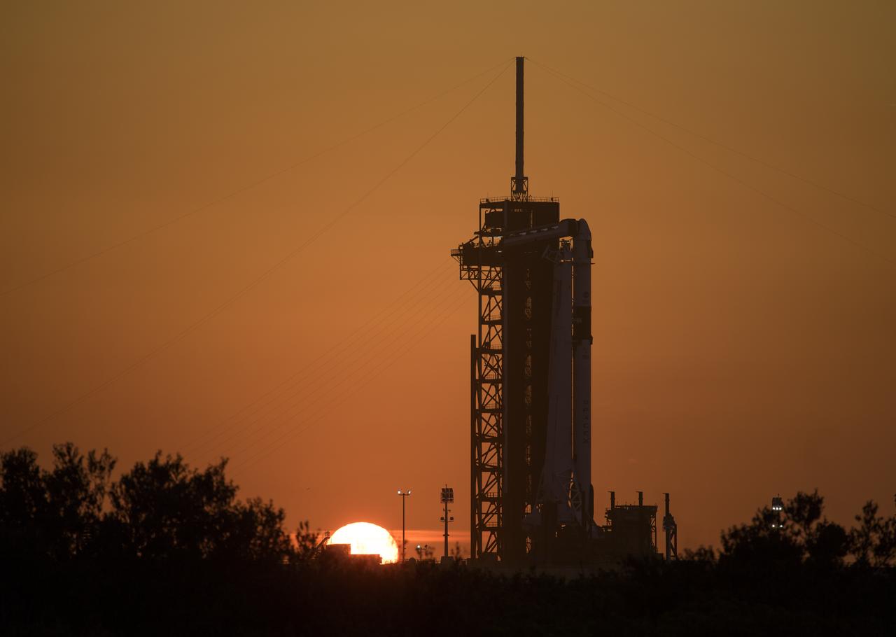 A SpaceX Falcon 9 rocket with the company's Crew Dragon spacecraft onboard is seen on the launch pad at Launch Complex 39A as preparations continue for the Demo-2 mission, Wednesday, May 27, 2020, at NASA’s Kennedy Space Center in Florida. NASA’s SpaceX Demo-2 mission is the first launch with astronauts of the SpaceX Crew Dragon spacecraft and Falcon 9 rocket to the International Space Station as part of the agency’s Commercial Crew Program. The test flight serves as an end-to-end demonstration of SpaceX’s crew transportation system. Today’s launch of Behnken and Hurley was scrubbed due to weather and is now scheduled for 3:22 p.m. EDT on Saturday, May 30, from Launch Complex 39A at the Kennedy Space Center. A new era of human spaceflight is set to begin as American astronauts once again launch on an American rocket from American soil to low-Earth orbit for the first time since the conclusion of the Space Shuttle Program in 2011. Photo Credit: (NASA/Bill Ingalls)