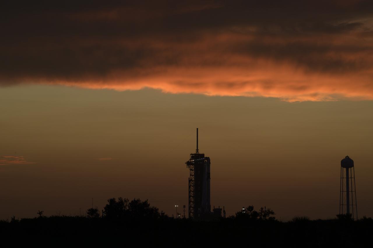 A SpaceX Falcon 9 rocket with the company's Crew Dragon spacecraft onboard is seen on the launch pad at Launch Complex 39A as preparations continue for the Demo-2 mission, Wednesday, May 27, 2020, at NASA’s Kennedy Space Center in Florida. NASA’s SpaceX Demo-2 mission is the first launch with astronauts of the SpaceX Crew Dragon spacecraft and Falcon 9 rocket to the International Space Station as part of the agency’s Commercial Crew Program. The test flight serves as an end-to-end demonstration of SpaceX’s crew transportation system. Today’s launch of Behnken and Hurley was scrubbed due to weather and is now scheduled for 3:22 p.m. EDT on Saturday, May 30, from Launch Complex 39A at the Kennedy Space Center. A new era of human spaceflight is set to begin as American astronauts once again launch on an American rocket from American soil to low-Earth orbit for the first time since the conclusion of the Space Shuttle Program in 2011. Photo Credit: (NASA/Bill Ingalls)