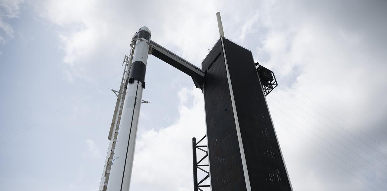 A SpaceX Falcon 9 rocket with the company's Crew Dragon spacecraft onboard is seen on the launch pad at Launch Complex 39A as preparations continue for the Demo-2 mission, Thursday, May 28, 2020, at NASA’s Kennedy Space Center in Florida. NASA’s SpaceX Demo-2 mission is the first launch with astronauts of the SpaceX Crew Dragon spacecraft and Falcon 9 rocket to the International Space Station as part of the agency’s Commercial Crew Program. The test flight serves as an end-to-end demonstration of SpaceX’s crew transportation system. Robert Behnken and Douglas Hurley are scheduled to launch at 3:22 p.m. EDT on Saturday, May 30, from Launch Complex 39A at the Kennedy Space Center. A new era of human spaceflight is set to begin as American astronauts once again launch on an American rocket from American soil to low-Earth orbit for the first time since the conclusion of the Space Shuttle Program in 2011. Photo Credit: (NASA/Joel Kowsky)