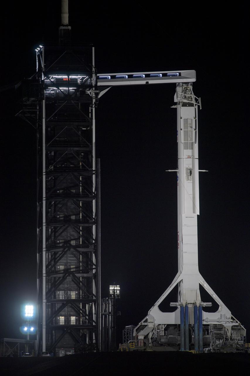 A SpaceX Falcon 9 rocket with the company's Crew Dragon spacecraft onboard is seen on the launch pad at Launch Complex 39A as preparations continue for the Demo-2 mission, Friday, May 29, 2020, at NASA’s Kennedy Space Center in Florida. NASA’s SpaceX Demo-2 mission is the first launch with astronauts of the SpaceX Crew Dragon spacecraft and Falcon 9 rocket to the International Space Station as part of the agency’s Commercial Crew Program. The test flight serves as an end-to-end demonstration of SpaceX’s crew transportation system. Robert Behnken and Douglas Hurley are scheduled to launch at 3:22 p.m. EDT on Saturday, May 30, from Launch Complex 39A at the Kennedy Space Center. A new era of human spaceflight is set to begin as American astronauts once again launch on an American rocket from American soil to low-Earth orbit for the first time since the conclusion of the Space Shuttle Program in 2011. Photo Credit: (NASA/Bill Ingalls)