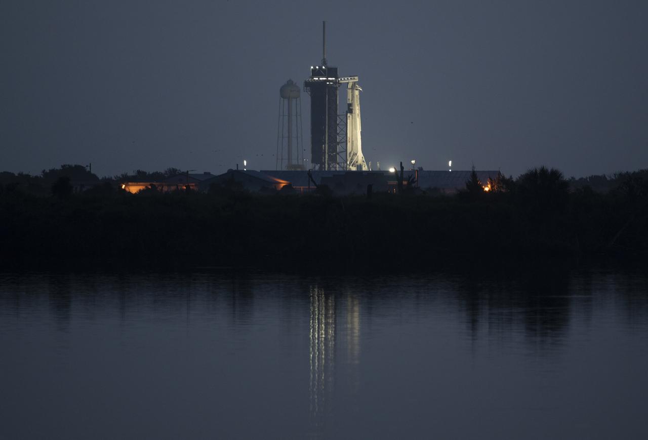 A SpaceX Falcon 9 rocket with the company's Crew Dragon spacecraft onboard is seen illuminated on the launch pad at Launch Complex 39A as preparations continue for NASA’s SpaceX Demo-2 mission, Saturday, May 30, 2020, at NASA’s Kennedy Space Center in Florida. NASA’s SpaceX Demo-2 mission is the first launch with astronauts of the SpaceX Crew Dragon spacecraft and Falcon 9 rocket to the International Space Station as part of the agency’s Commercial Crew Program. The test flight serves as an end-to-end demonstration of SpaceX’s crew transportation system. Robert Behnken and Douglas Hurley are scheduled to launch at 3:22 p.m. EDT on Saturday, May 30, from Launch Complex 39A at the Kennedy Space Center. A new era of human spaceflight is set to begin as American astronauts once again launch on an American rocket from American soil to low-Earth orbit for the first time since the conclusion of the Space Shuttle Program in 2011. Photo Credit: (NASA/Joel Kowsky)