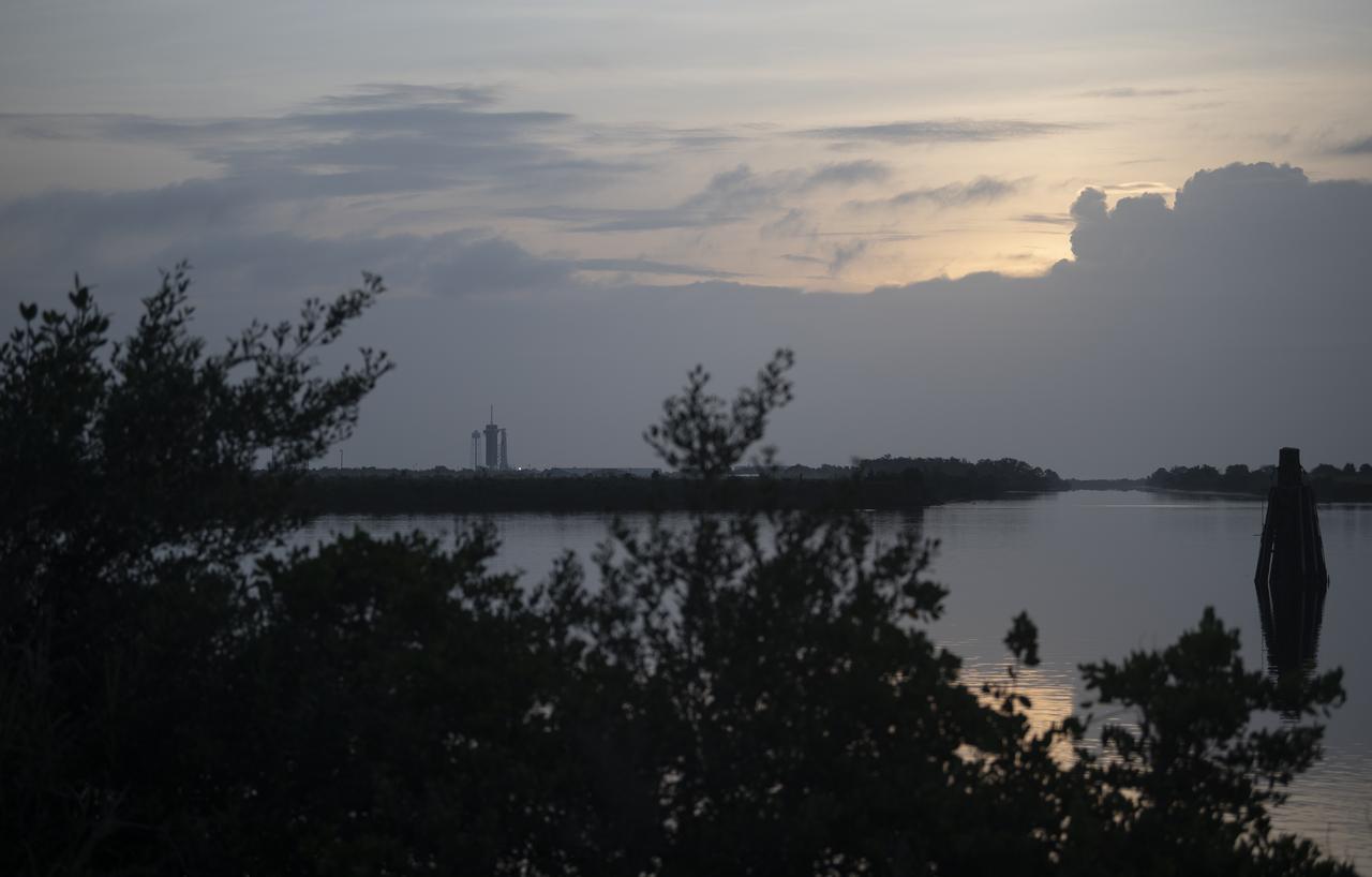 A SpaceX Falcon 9 rocket with the company's Crew Dragon spacecraft onboard is seen at sunrise on the launch pad at Launch Complex 39A as preparations continue for the Demo-2 mission, Saturday, May 30, 2020, at NASA’s Kennedy Space Center in Florida. NASA’s SpaceX Demo-2 mission is the first launch with astronauts of the SpaceX Crew Dragon spacecraft and Falcon 9 rocket to the International Space Station as part of the agency’s Commercial Crew Program. The test flight serves as an end-to-end demonstration of SpaceX’s crew transportation system. Robert Behnken and Douglas Hurley are scheduled to launch at 3:22 p.m. EDT on Saturday, May 30, from Launch Complex 39A at the Kennedy Space Center. A new era of human spaceflight is set to begin as American astronauts once again launch on an American rocket from American soil to low-Earth orbit for the first time since the conclusion of the Space Shuttle Program in 2011. Photo Credit: (NASA/Joel Kowsky)