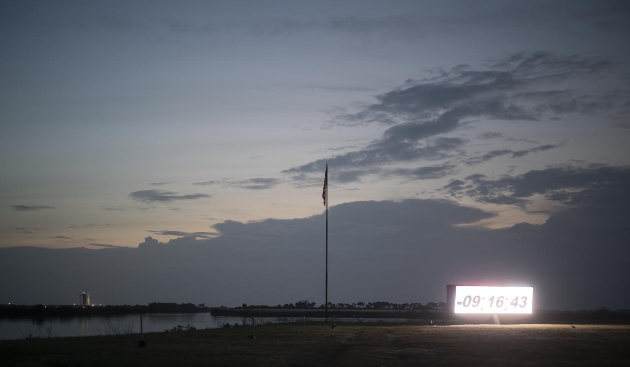 The countdown clock at NASA’s Kennedy Space Center Press Site is seen during sunrise on launch day for NASA’s SpaceX Demo-2 mission, Saturday, May 30, 2020, in Florida. NASA’s SpaceX Demo-2 mission is the first launch with astronauts of the SpaceX Crew Dragon spacecraft and Falcon 9 rocket to the International Space Station as part of the agency’s Commercial Crew Program. The test flight serves as an end-to-end demonstration of SpaceX’s crew transportation system. Robert Behnken and Douglas Hurley are scheduled to launch at 3:22 p.m. EDT on Saturday, May 30, from Launch Complex 39A at the Kennedy Space Center. A new era of human spaceflight is set to begin as American astronauts once again launch on an American rocket from American soil to low-Earth orbit for the first time since the conclusion of the Space Shuttle Program in 2011. Photo Credit: (NASA/Joel Kowsky)