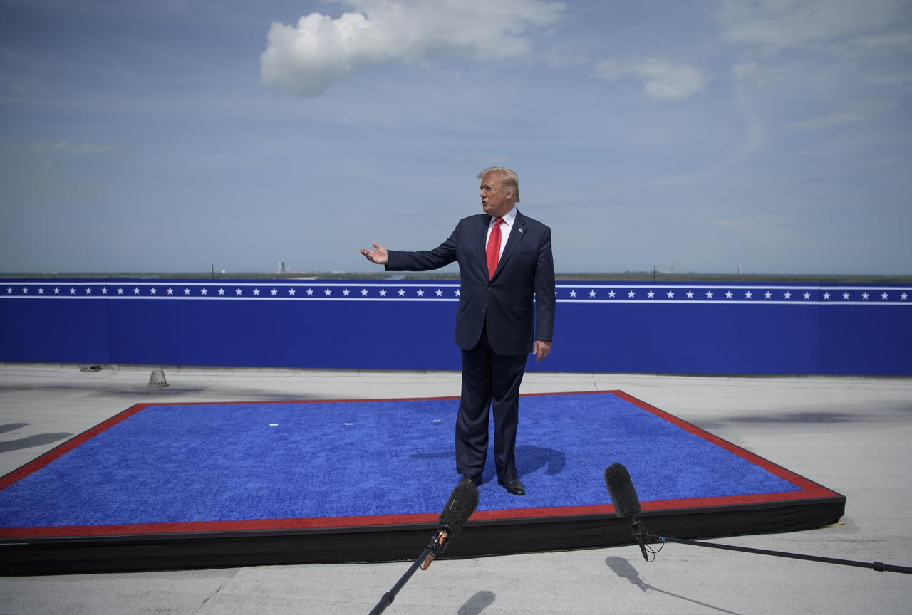 President Donald Trump speaks at the  Operations Support Building II after the launch of a SpaceX Falcon 9 rocket carrying the company's Crew Dragon spacecraft on NASA’s SpaceX Demo-2 mission with NASA astronauts Robert Behnken and Douglas Hurley onboard, Saturday, May 30, 2020, at NASA’s Kennedy Space Center in Florida. NASA’s SpaceX Demo-2 mission is the first launch with astronauts of the SpaceX Crew Dragon spacecraft and Falcon 9 rocket to the International Space Station as part of the agency’s Commercial Crew Program. The test flight serves as an end-to-end demonstration of SpaceX’s crew transportation system. Behnken and Hurley launched at 3:22 p.m. EDT on Saturday, May 30, from Launch Complex 39A at the Kennedy Space Center. A new era of human spaceflight is set to begin as American astronauts once again launch on an American rocket from American soil to low-Earth orbit for the first time since the conclusion of the Space Shuttle Program in 2011. Photo Credit: (NASA/Bill Ingalls)