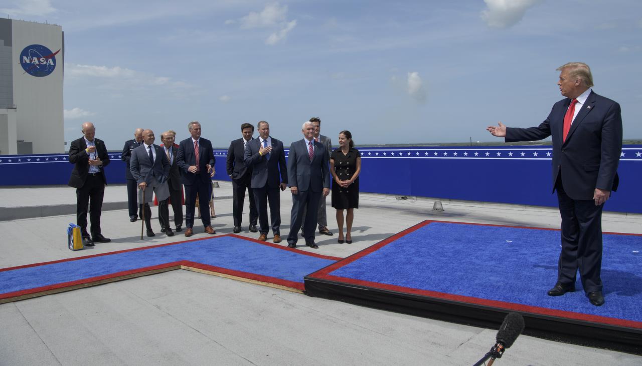 President Donald Trump congratulates NASA Administrator Jim Bridenstine, hand on chest, at the Operations Support Building II after the launch of a SpaceX Falcon 9 rocket carrying the company's Crew Dragon spacecraft on NASA’s SpaceX Demo-2 mission with NASA astronauts Robert Behnken and Douglas Hurley onboard, Saturday, May 30, 2020, at NASA’s Kennedy Space Center in Florida. NASA’s SpaceX Demo-2 mission is the first launch with astronauts of the SpaceX Crew Dragon spacecraft and Falcon 9 rocket to the International Space Station as part of the agency’s Commercial Crew Program. The test flight serves as an end-to-end demonstration of SpaceX’s crew transportation system. Behnken and Hurley launched at 3:22 p.m. EDT on Saturday, May 30, from Launch Complex 39A at the Kennedy Space Center. A new era of human spaceflight is set to begin as American astronauts once again launch on an American rocket from American soil to low-Earth orbit for the first time since the conclusion of the Space Shuttle Program in 2011. Photo Credit: (NASA/Bill Ingalls)