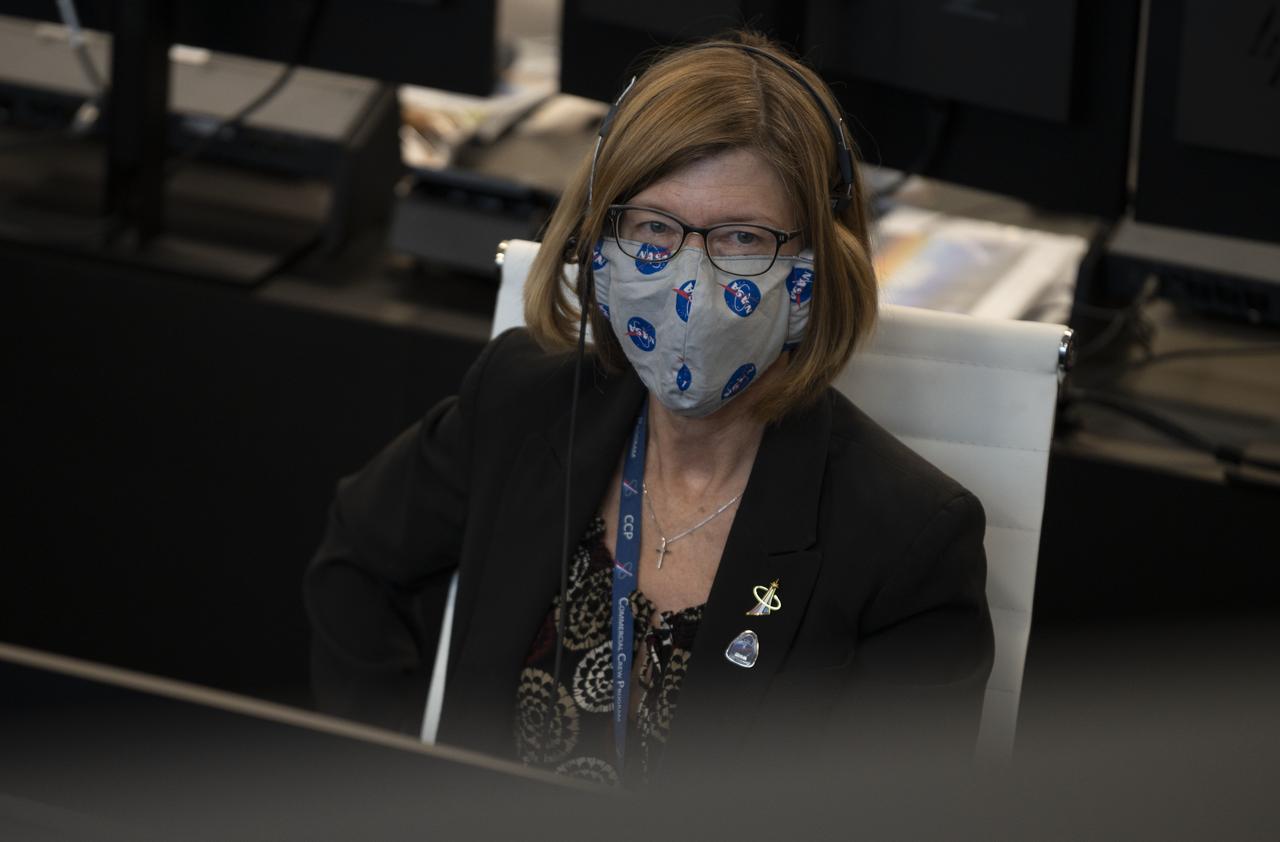 Kathy Lueders, manager of NASA's Commercial Crew Program is seen monitoring the launch of a SpaceX Falcon 9 rocket carrying the company's Crew Dragon spacecraft on the Demo-2 mission with NASA astronauts Douglas Hurley and Robert Behnken onboard, Saturday, May 30, 2020, in  firing room four of the Launch Control Center at NASA’s Kennedy Space Center in Florida. NASA’s SpaceX Demo-2 mission is the first launch with astronauts of the SpaceX Crew Dragon spacecraft and Falcon 9 rocket to the International Space Station as part of the agency’s Commercial Crew Program. The test flight serves as an end-to-end demonstration of SpaceX’s crew transportation system. Behnken and Hurley launched at 3:22 p.m. EDT on Saturday, May 30, from Launch Complex 39A at the Kennedy Space Center. A new era of human spaceflight is set to begin as American astronauts once again launch on an American rocket from American soil to low-Earth orbit for the first time since the conclusion of the Space Shuttle Program in 2011. Photo Credit: (NASA/Joel Kowsky)