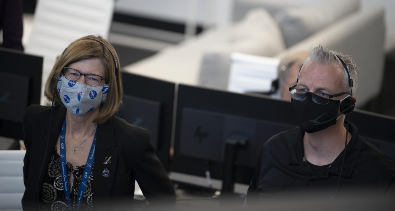 Kathy Lueders, manager of NASA's Commercial Crew Program, left, and Benji Reed, director of crew mission management at SpaceX, right, monitor the launch of a SpaceX Falcon 9 rocket carrying the company's Crew Dragon spacecraft on the Demo-2 mission with NASA astronauts Douglas Hurley and Robert Behnken onboard, Saturday, May 30, 2020, in  firing room four of the Launch Control Center at NASA’s Kennedy Space Center in Florida. NASA’s SpaceX Demo-2 mission is the first launch with astronauts of the SpaceX Crew Dragon spacecraft and Falcon 9 rocket to the International Space Station as part of the agency’s Commercial Crew Program. The test flight serves as an end-to-end demonstration of SpaceX’s crew transportation system. Behnken and Hurley launched at 3:22 p.m. EDT on Saturday, May 30, from Launch Complex 39A at the Kennedy Space Center. A new era of human spaceflight is set to begin as American astronauts once again launch on an American rocket from American soil to low-Earth orbit for the first time since the conclusion of the Space Shuttle Program in 2011. Photo Credit: (NASA/Joel Kowsky)