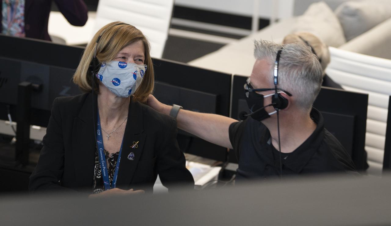 Kathy Lueders, manager of NASA's Commercial Crew Program, left, and Benji Reed, director of crew mission management at SpaceX are seen during the launch of a SpaceX Falcon 9 rocket carrying the company's Crew Dragon spacecraft on the Demo-2 mission with NASA astronauts Douglas Hurley and Robert Behnken onboard, Saturday, May 30, 2020, in  firing room four of the Launch Control Center at NASA’s Kennedy Space Center in Florida. NASA’s SpaceX Demo-2 mission is the first launch with astronauts of the SpaceX Crew Dragon spacecraft and Falcon 9 rocket to the International Space Station as part of the agency’s Commercial Crew Program. The test flight serves as an end-to-end demonstration of SpaceX’s crew transportation system. Behnken and Hurley launched at 3:22 p.m. EDT on Saturday, May 30, from Launch Complex 39A at the Kennedy Space Center. A new era of human spaceflight is set to begin as American astronauts once again launch on an American rocket from American soil to low-Earth orbit for the first time since the conclusion of the Space Shuttle Program in 2011. Photo Credit: (NASA/Joel Kowsky)