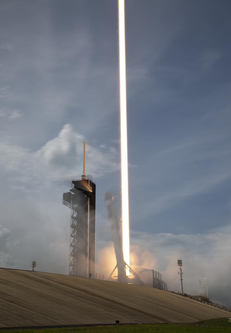 A SpaceX Falcon 9 rocket carrying the company's Crew Dragon spacecraft is seen in this 15 second exposure as it is launched from Launch Complex 39A on NASA’s SpaceX Demo-2 mission to the International Space Station with NASA astronauts Robert Behnken and Douglas Hurley onboard, Saturday, May 30, 2020, at NASA’s Kennedy Space Center in Florida. The Demo-2 mission is the first launch with astronauts of the SpaceX Crew Dragon spacecraft and Falcon 9 rocket to the International Space Station as part of the agency’s Commercial Crew Program. The test flight serves as an end-to-end demonstration of SpaceX’s crew transportation system. Behnken and Hurley launched at 3:22 p.m. EDT on Saturday, May 30, from Launch Complex 39A at the Kennedy Space Center. A new era of human spaceflight is set to begin as American astronauts once again launch on an American rocket from American soil to low-Earth orbit for the first time since the conclusion of the Space Shuttle Program in 2011. Photo Credit: (NASA/Bill Ingalls)