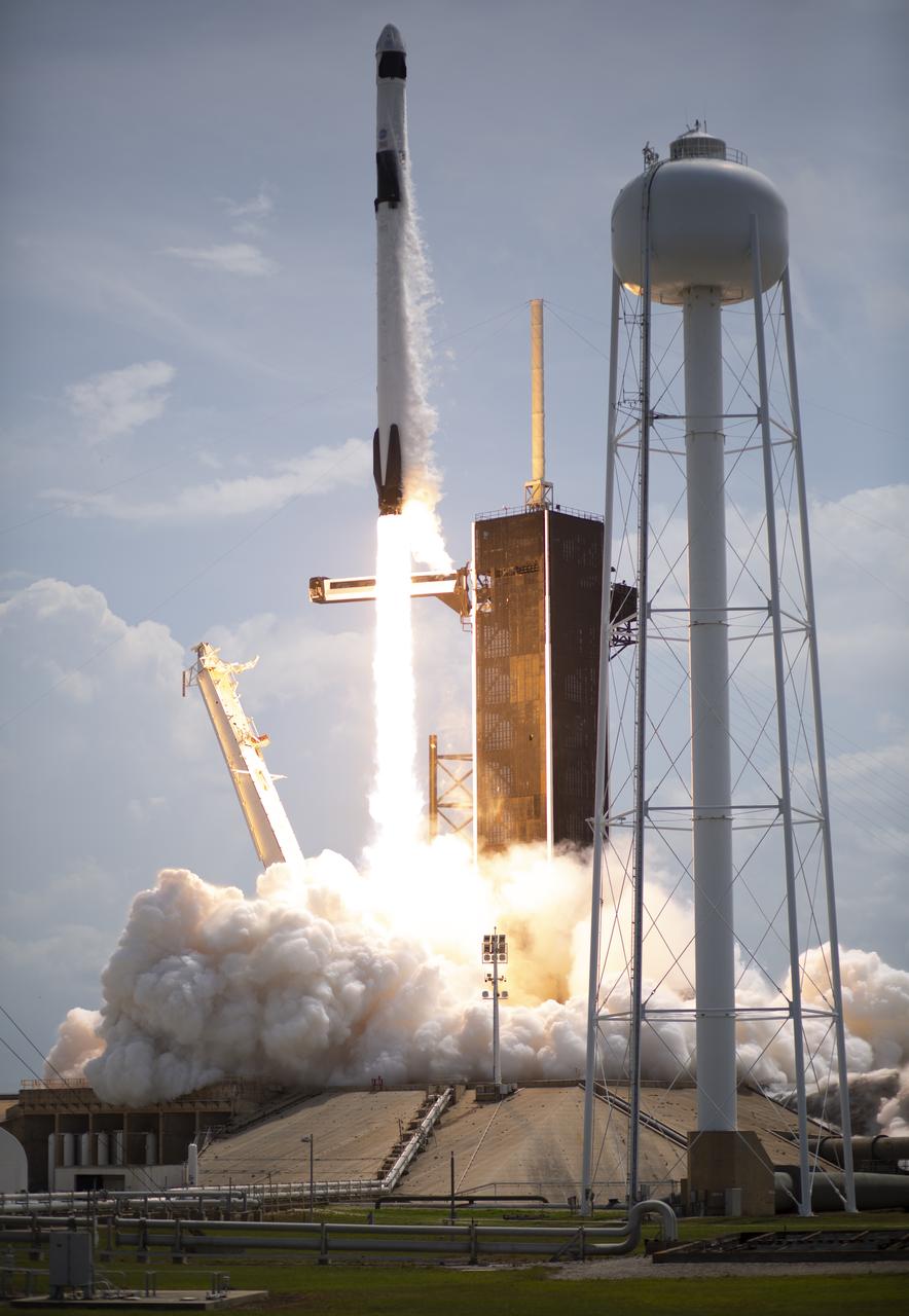 A SpaceX Falcon 9 rocket carrying the company's Crew Dragon spacecraft is launched from Launch Complex 39A on NASA’s SpaceX Demo-2 mission to the International Space Station with NASA astronauts Robert Behnken and Douglas Hurley onboard, Saturday, May 30, 2020, at NASA’s Kennedy Space Center in Florida. The Demo-2 mission is the first launch with astronauts of the SpaceX Crew Dragon spacecraft and Falcon 9 rocket to the International Space Station as part of the agency’s Commercial Crew Program. The test flight serves as an end-to-end demonstration of SpaceX’s crew transportation system. Behnken and Hurley launched at 3:22 p.m. EDT on Saturday, May 30, from Launch Complex 39A at the Kennedy Space Center. A new era of human spaceflight is set to begin as American astronauts once again launch on an American rocket from American soil to low-Earth orbit for the first time since the conclusion of the Space Shuttle Program in 2011. Photo Credit: (NASA/Joel Kowsky)