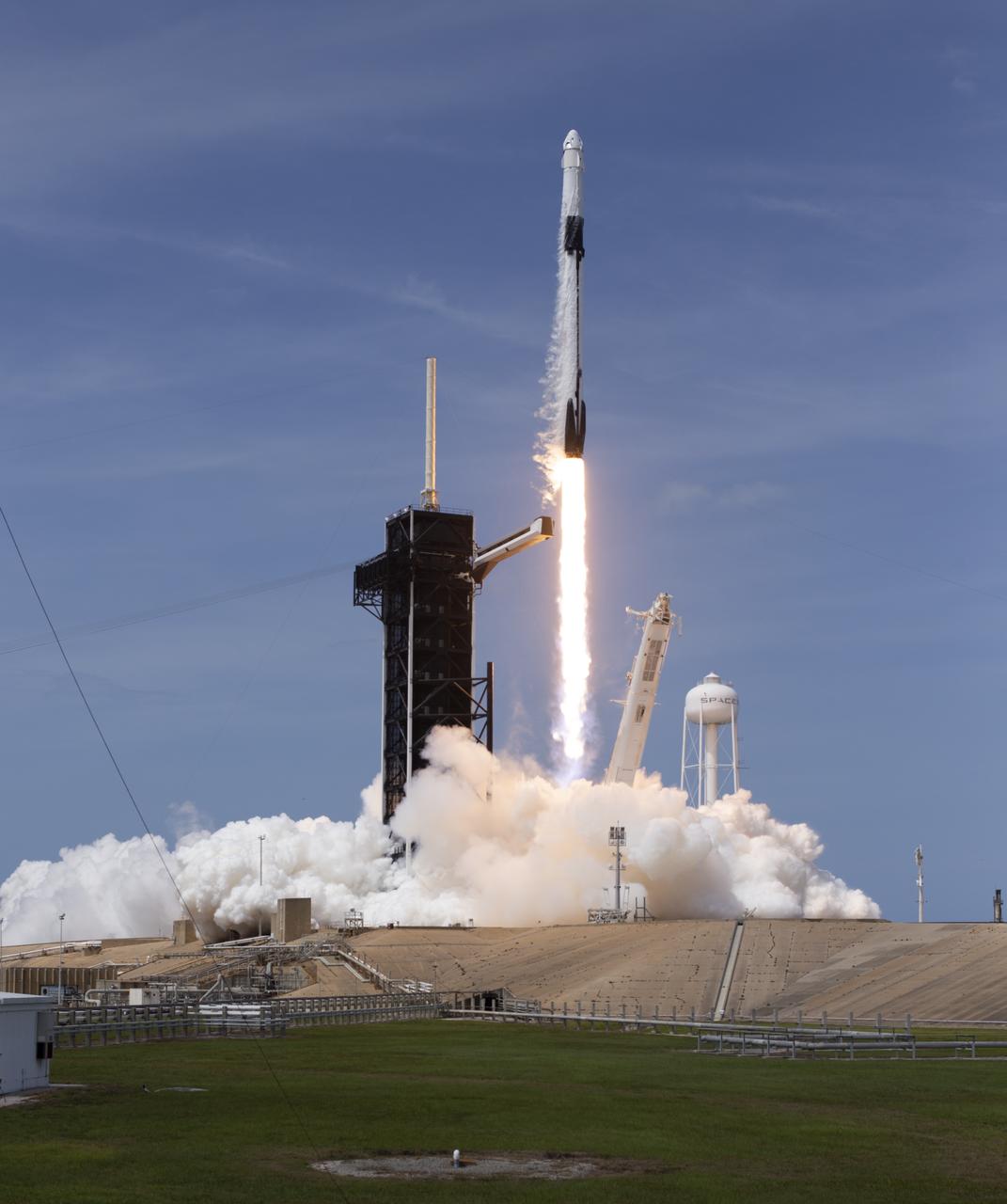 A SpaceX Falcon 9 rocket carrying the company's Crew Dragon spacecraft is launched from Launch Complex 39A on NASA’s SpaceX Demo-2 mission to the International Space Station with NASA astronauts Robert Behnken and Douglas Hurley onboard, Saturday, May 30, 2020, at NASA’s Kennedy Space Center in Florida. The Demo-2 mission is the first launch with astronauts of the SpaceX Crew Dragon spacecraft and Falcon 9 rocket to the International Space Station as part of the agency’s Commercial Crew Program. The test flight serves as an end-to-end demonstration of SpaceX’s crew transportation system. Behnken and Hurley launched at 3:22 p.m. EDT on Saturday, May 30, from Launch Complex 39A at the Kennedy Space Center. A new era of human spaceflight is set to begin as American astronauts once again launch on an American rocket from American soil to low-Earth orbit for the first time since the conclusion of the Space Shuttle Program in 2011. Photo Credit: (NASA/Joel Kowsky)