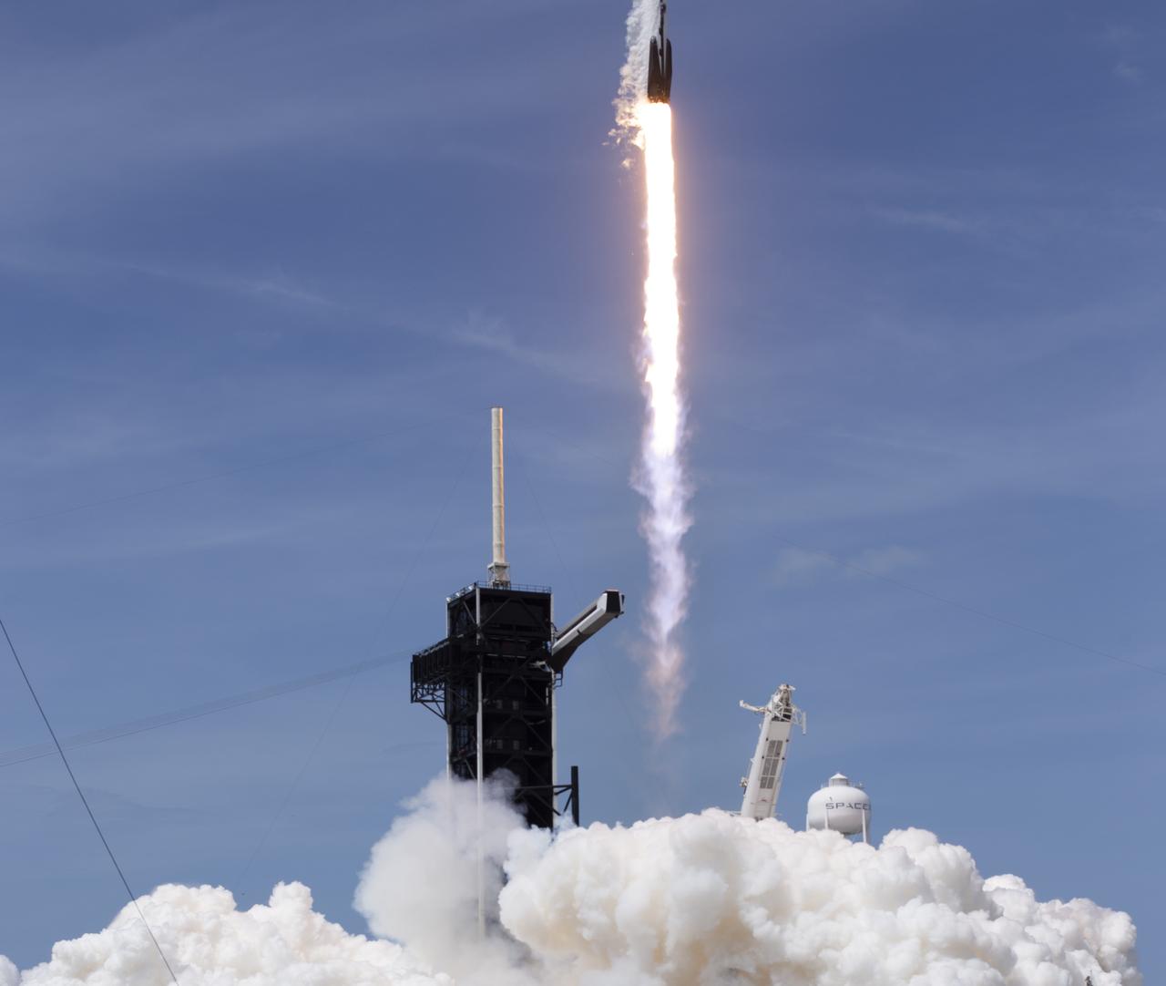 A SpaceX Falcon 9 rocket carrying the company's Crew Dragon spacecraft is launched from Launch Complex 39A on NASA’s SpaceX Demo-2 mission to the International Space Station with NASA astronauts Robert Behnken and Douglas Hurley onboard, Saturday, May 30, 2020, at NASA’s Kennedy Space Center in Florida. The Demo-2 mission is the first launch with astronauts of the SpaceX Crew Dragon spacecraft and Falcon 9 rocket to the International Space Station as part of the agency’s Commercial Crew Program. The test flight serves as an end-to-end demonstration of SpaceX’s crew transportation system. Behnken and Hurley launched at 3:22 p.m. EDT on Saturday, May 30, from Launch Complex 39A at the Kennedy Space Center. A new era of human spaceflight is set to begin as American astronauts once again launch on an American rocket from American soil to low-Earth orbit for the first time since the conclusion of the Space Shuttle Program in 2011. Photo Credit: (NASA/Joel Kowsky)