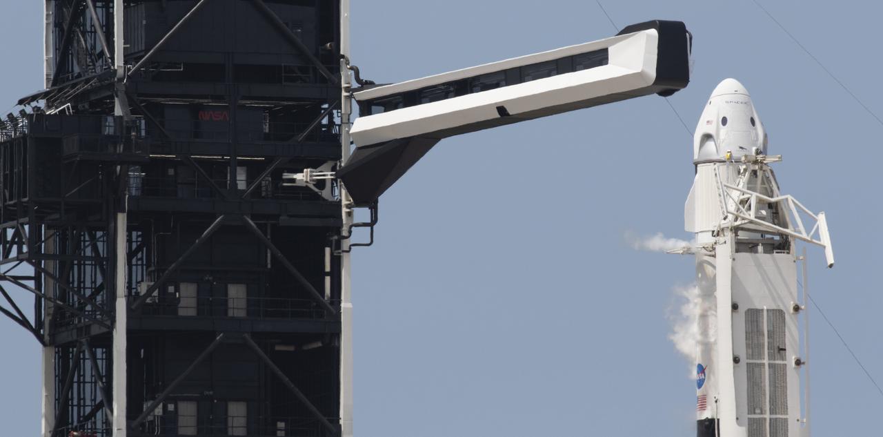 A SpaceX Falcon 9 rocket carrying the company's Crew Dragon spacecraft is seen prior to launch on NASA’s SpaceX Demo-2 mission to the International Space Station with NASA astronauts Robert Behnken and Douglas Hurley onboard, Saturday, May 30, 2020, at Launch Complex 39A at NASA’s Kennedy Space Center in Florida. The Demo-2 mission is the first launch with astronauts of the SpaceX Crew Dragon spacecraft and Falcon 9 rocket to the International Space Station as part of the agency’s Commercial Crew Program. The test flight serves as an end-to-end demonstration of SpaceX’s crew transportation system. Behnken and Hurley launched at 3:22 p.m. EDT on Saturday, May 30, from Launch Complex 39A at the Kennedy Space Center. A new era of human spaceflight is set to begin as American astronauts once again launch on an American rocket from American soil to low-Earth orbit for the first time since the conclusion of the Space Shuttle Program in 2011. Photo Credit: (NASA/Joel Kowsky)