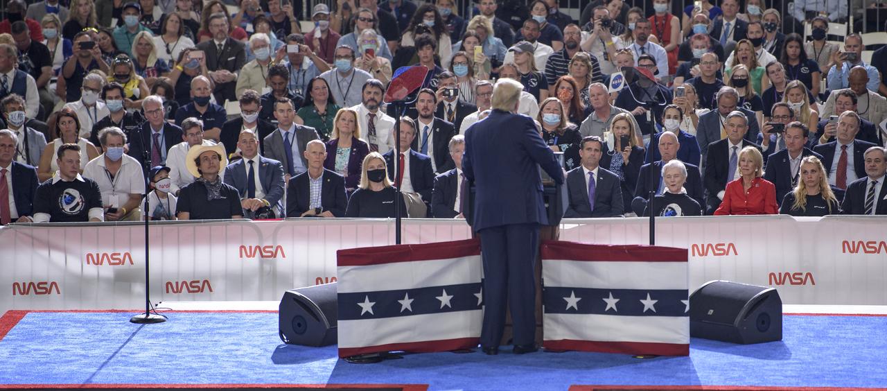 President Donald Trump speaks inside the Vehicle Assembly Building following the launch of a SpaceX Falcon 9 rocket carrying the company's Crew Dragon spacecraft on NASA’s SpaceX Demo-2 mission with NASA astronauts Robert Behnken and Douglas Hurley onboard, Saturday, May 30, 2020, at NASA’s Kennedy Space Center in Florida. NASA’s SpaceX Demo-2 mission is the first launch with astronauts of the SpaceX Crew Dragon spacecraft and Falcon 9 rocket to the International Space Station as part of the agency’s Commercial Crew Program. The test flight serves as an end-to-end demonstration of SpaceX’s crew transportation system. Behnken and Hurley launched at 3:22 p.m. EDT on Saturday, May 30, from Launch Complex 39A at the Kennedy Space Center. A new era of human spaceflight is set to begin as American astronauts once again launch on an American rocket from American soil to low-Earth orbit for the first time since the conclusion of the Space Shuttle Program in 2011. Photo Credit: (NASA/Bill Ingalls)