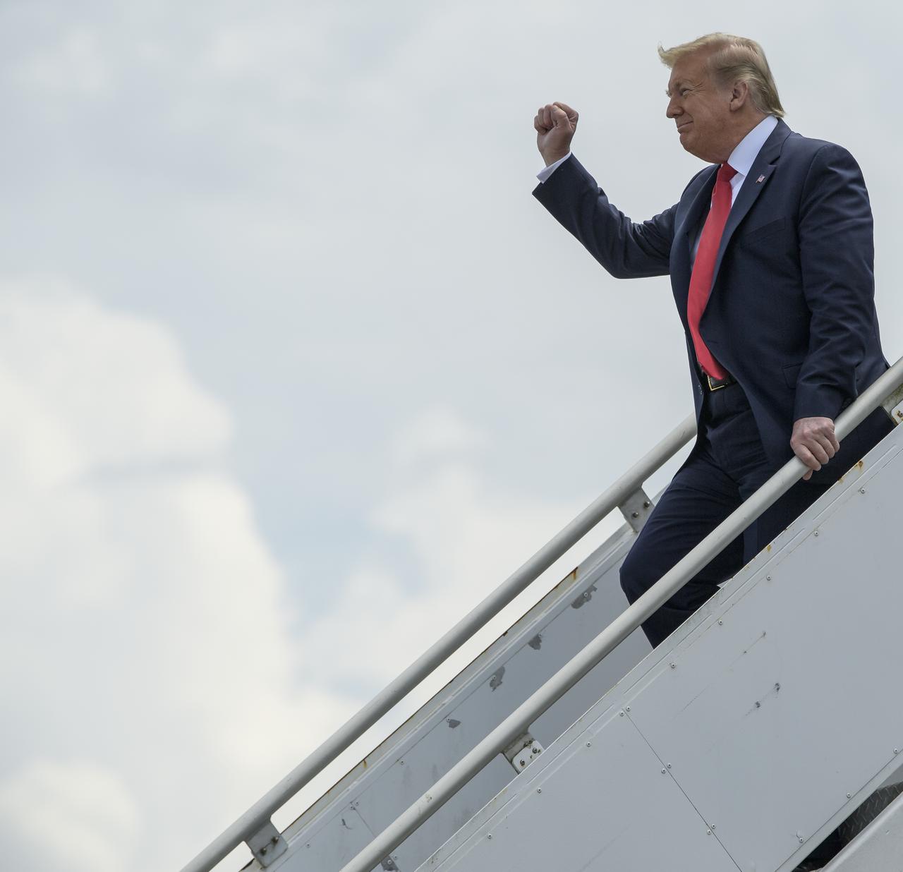 President Donald Trump departs Air Force One after arriving at NASA’s Kennedy Space Center Launch and Landing Facility ahead of SpaceX’s Demo-2 mission, Saturday, May 30, 2020, in Florida. NASA’s SpaceX Demo-2 mission is the first launch with astronauts of the SpaceX Crew Dragon spacecraft and Falcon 9 rocket to the International Space Station as part of the agency’s Commercial Crew Program. The test flight serves as an end-to-end demonstration of SpaceX’s crew transportation system. Behnken and Hurley are scheduled to launch at 3:22 p.m. EDT on Saturday, May 30, from Launch Complex 39A at the Kennedy Space Center. A new era of human spaceflight is set to begin as American astronauts once again launch on an American rocket from American soil to low-Earth orbit for the first time since the conclusion of the Space Shuttle Program in 2011.  Photo Credit: (NASA/Bill Ingalls)