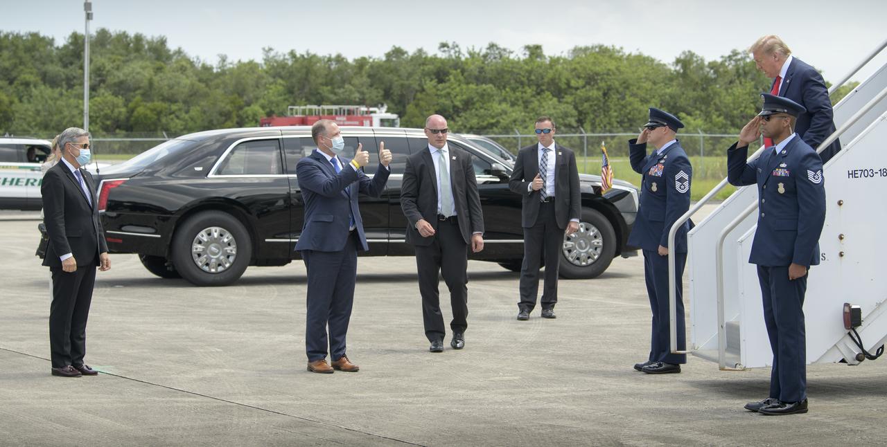 NASA Kennedy Space Center Director Bob Cabana, left, and NASA Administrator Jim Bridenstine welcome President Donald Trump after he arrived at NASA’s Kennedy Space Center Launch and Landing Facility on Air Force One ahead of SpaceX’s Demo-2 mission, Saturday, May 30, 2020, in Florida. NASA’s SpaceX Demo-2 mission is the first launch with astronauts of the SpaceX Crew Dragon spacecraft and Falcon 9 rocket to the International Space Station as part of the agency’s Commercial Crew Program. The test flight serves as an end-to-end demonstration of SpaceX’s crew transportation system. Behnken and Hurley are scheduled to launch at 3:22 p.m. EDT on Saturday, May 30, from Launch Complex 39A at the Kennedy Space Center. A new era of human spaceflight is set to begin as American astronauts once again launch on an American rocket from American soil to low-Earth orbit for the first time since the conclusion of the Space Shuttle Program in 2011.  Photo Credit: (NASA/Bill Ingalls)