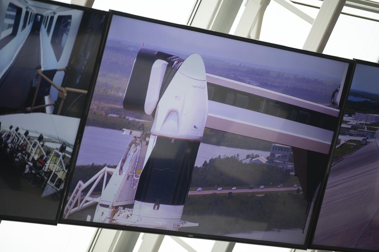The convoy carrying NASA astronauts Robert Behnken and Douglas Hurley is seen through the windows of firing room four as it makes its way to Launch Complex 39A , Saturday, May 30, 2020, in firing room four of the Launch Control Center at NASA’s Kennedy Space Center in Florida. NASA’s SpaceX Demo-2 mission is the first launch with astronauts of the SpaceX Crew Dragon spacecraft and Falcon 9 rocket to the International Space Station as part of the agency’s Commercial Crew Program. The test flight serves as an end-to-end demonstration of SpaceX’s crew transportation system. Behnken and Hurley launched at 3:22 p.m. EDT on Saturday, May 30, from Launch Complex 39A at the Kennedy Space Center. A new era of human spaceflight is set to begin as American astronauts once again launch on an American rocket from American soil to low-Earth orbit for the first time since the conclusion of the Space Shuttle Program in 2011. Photo Credit: (NASA/Joel Kowsky)